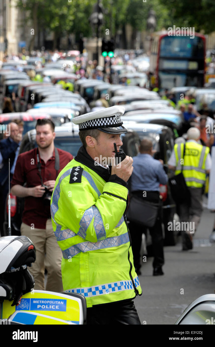 London, England, UK. Metropolitan police officers on duty during a taxi drivers' protest in central London, June 11, 2014 Stock Photo