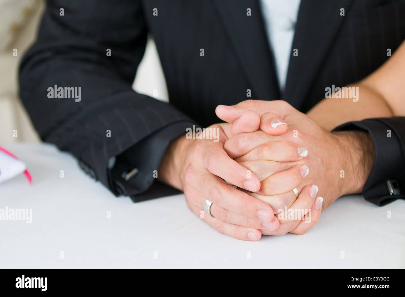 bride and groom holding hands Stock Photo