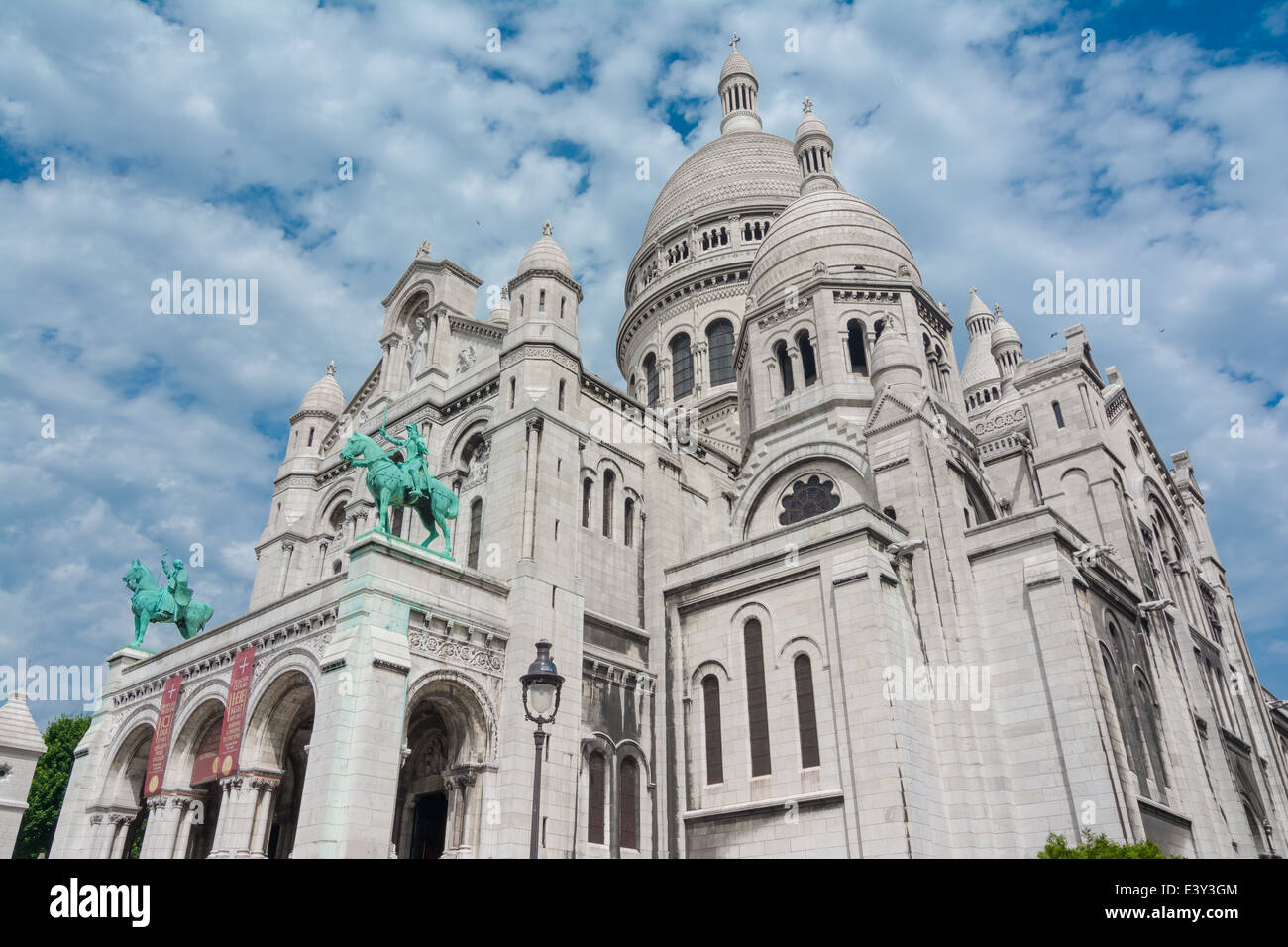 he Basilique Sacre Coeur (Basilica of the Sacred Heart) is a Roman Catholic church and familiar landmark in Paris Stock Photo