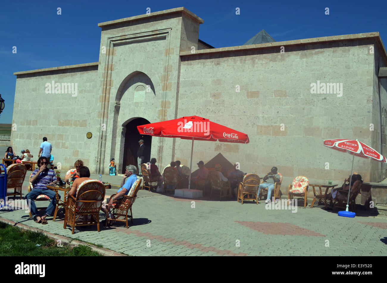 Modern tourists sit where traders & merchants and their animals used to occupy as they plied their trade across continents. Stock Photo