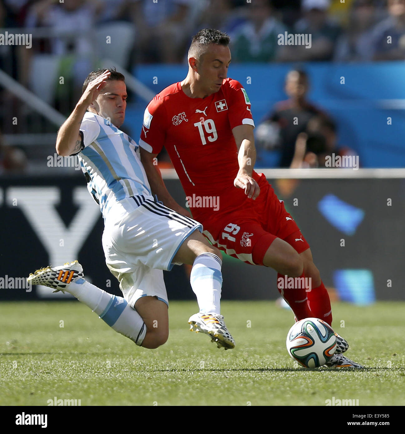Sao Paulo, Brazil. 1st July, 2014. Switzerland's Josip Drmic (R) vies with Argentina's Fernando Gago during a Round of 16 match between Argentina and Switzerland of 2014 FIFA World Cup at the Arena de Sao Paulo Stadium in Sao Paulo, Brazil, on July 1, 2014. Credit:  Wang Lili/Xinhua/Alamy Live News Stock Photo