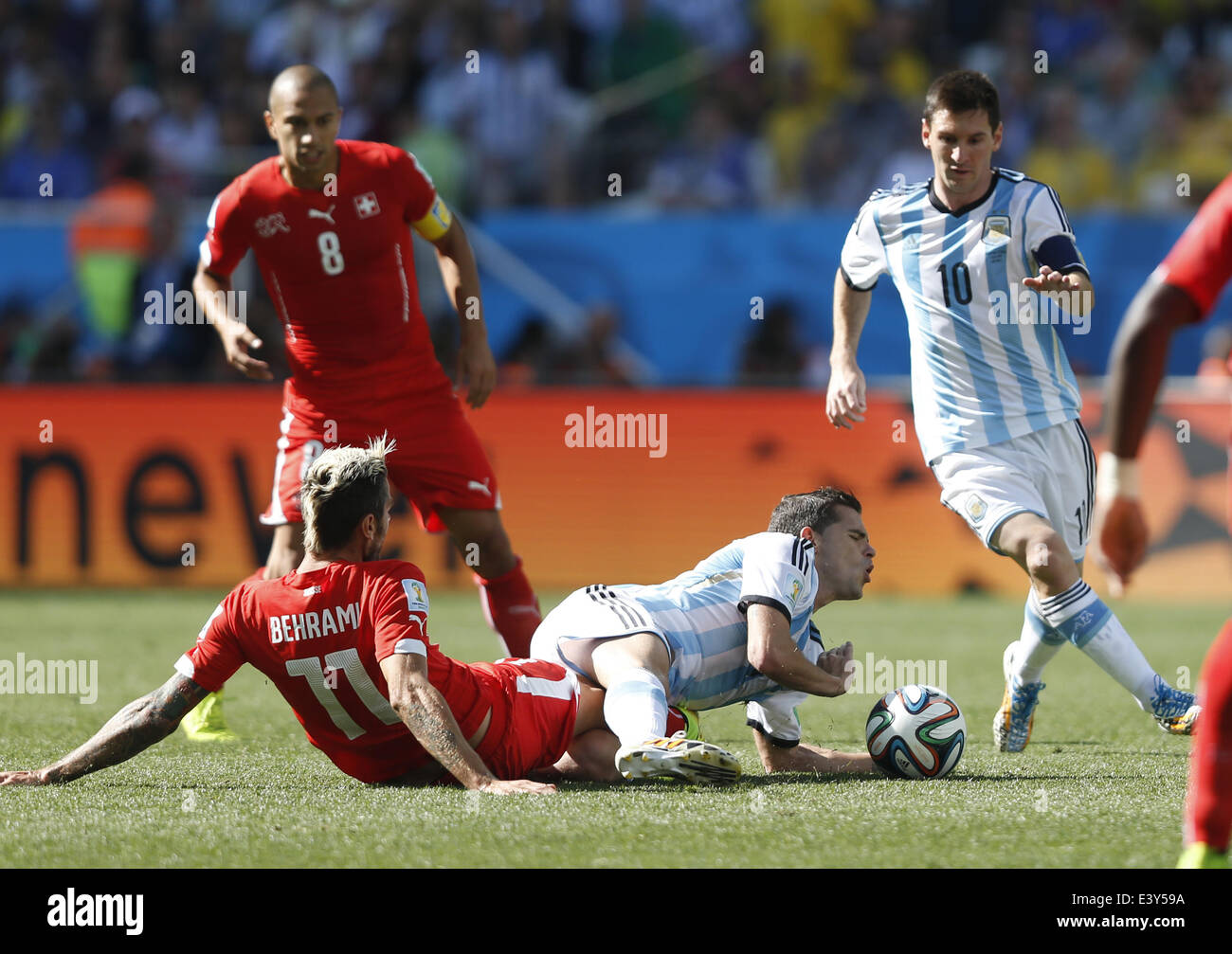 Sao Paulo, Brazil. 1st July, 2014. Switzerland's Valon Behrami (L, bottom) vies with Argentina's Fernando Gago (R, bottom) during a Round of 16 match between Argentina and Switzerland of 2014 FIFA World Cup at the Arena de Sao Paulo Stadium in Sao Paulo, Brazil, on July 1, 2014. Credit:  Wang Lili/Xinhua/Alamy Live News Stock Photo