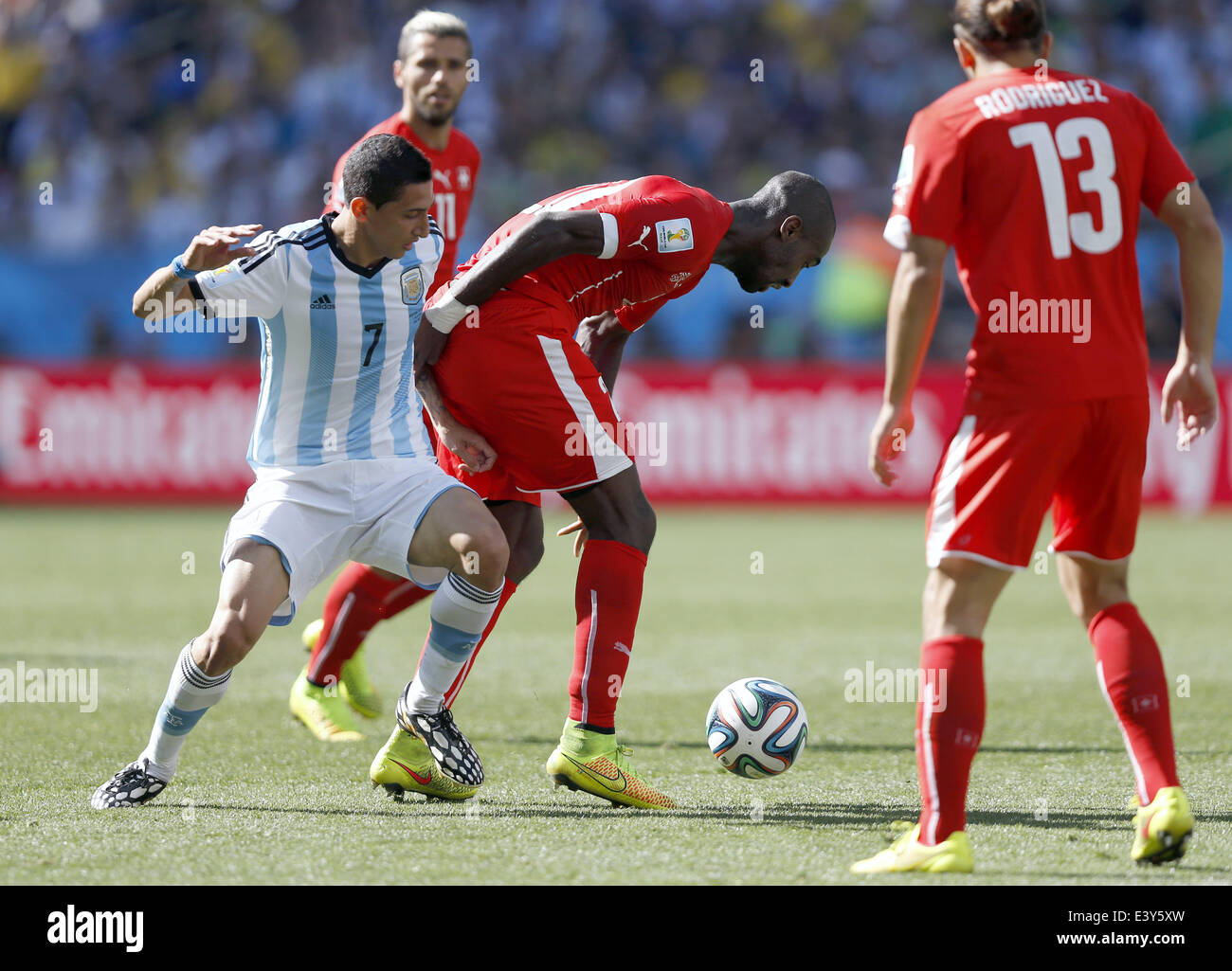 Sao Paulo, Brazil. 1st July, 2014. Argentina's Angel Di Maria (L) vies with Switzerland's Johan Djourou (2nd R) during a Round of 16 match between Argentina and Switzerland of 2014 FIFA World Cup at the Arena de Sao Paulo Stadium in Sao Paulo, Brazil, on July 1, 2014. Credit:  Wang Lili/Xinhua/Alamy Live News Stock Photo