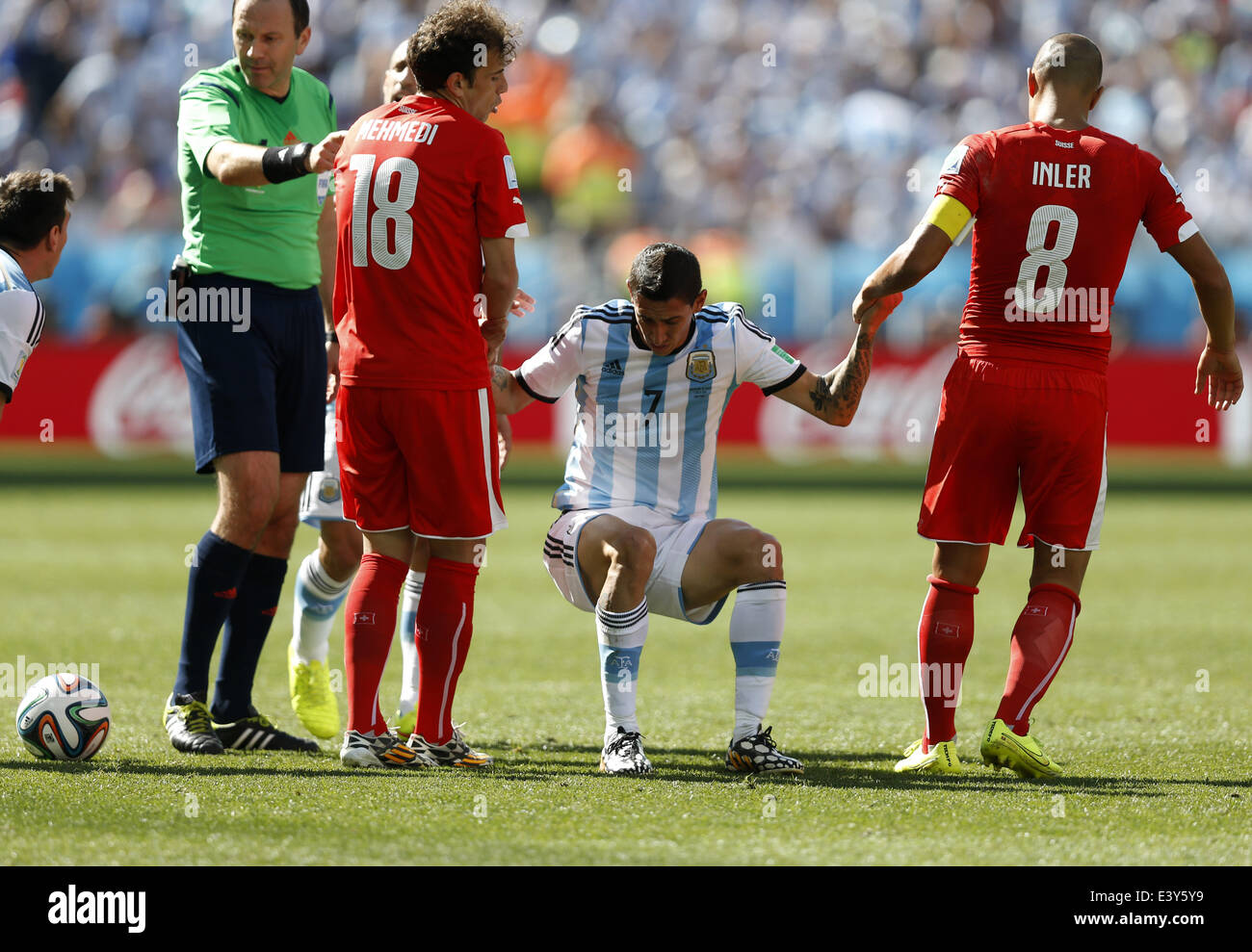 Sao Paulo, Brazil. 1st July, 2014. Switzerland's Admir Mehmedi (L, front) and Gokhan Inler (R, front) pull up Argentina's Angel Di Maria during a Round of 16 match between Argentina and Switzerland of 2014 FIFA World Cup at the Arena de Sao Paulo Stadium in Sao Paulo, Brazil, on July 1, 2014. Credit:  Wang Lili/Xinhua/Alamy Live News Stock Photo