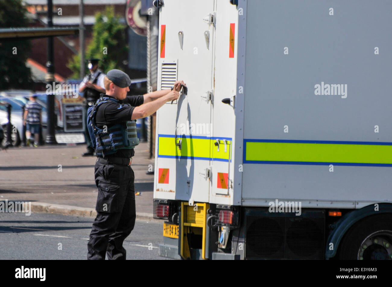 Belfast, Northern Ireland. 1 Jul 2014 - Army ATO (bomb squad) soldier unlocks the back of his lorry. Credit:  Stephen Barnes/Alamy Live News Stock Photo