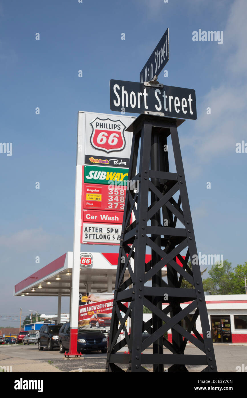 Gas City, Indiana - Street signs are supported by drilling rigs in a town named after a natural gas boom of 1887. Stock Photo