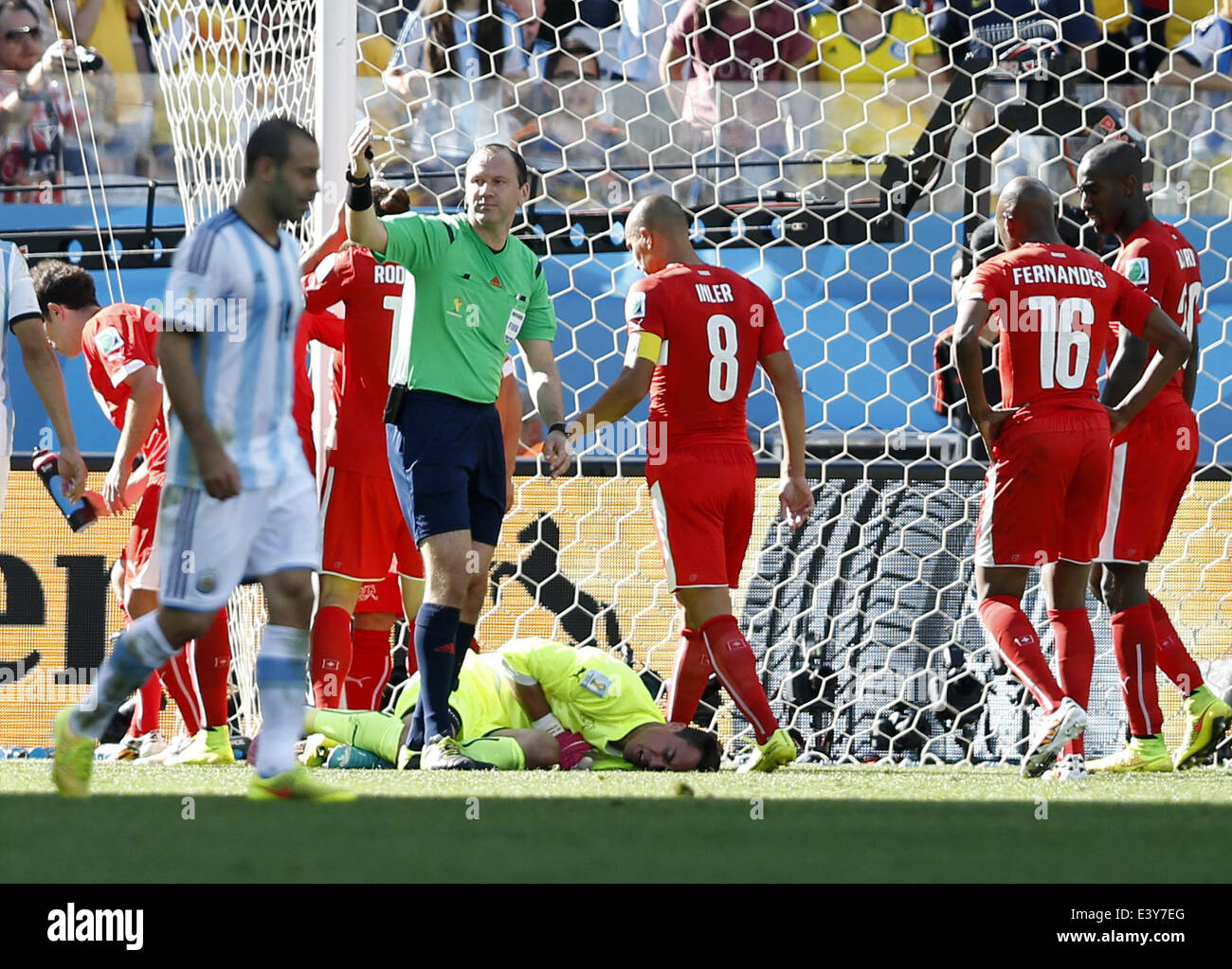 Sao Paulo, Brazil. 1st July, 2014. Switzerland's goalkeeper Diego Benaglio (bottom) falls down during a Round of 16 match between Argentina and Switzerland of 2014 FIFA World Cup at the Arena de Sao Paulo Stadium in Sao Paulo, Brazil, on July 1, 2014. Credit:  Wang Lili/Xinhua/Alamy Live News Stock Photo