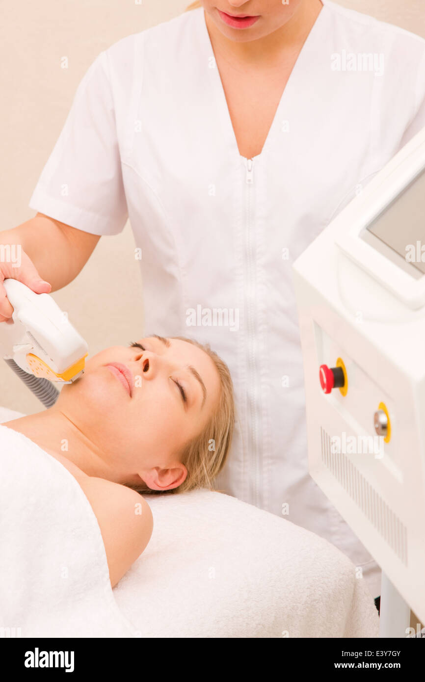 Woman getting light pulsed hair removal treatment Stock Photo Alamy