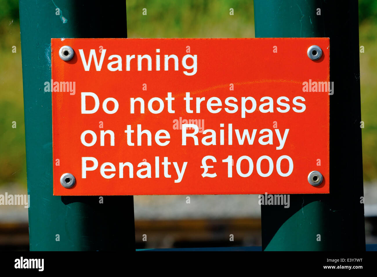 Warning do not trespass on the railway penalty £1000 red sign England uk Stock Photo