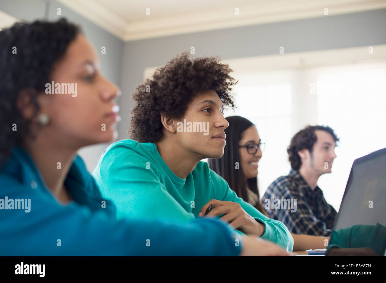 Students listening in classroom Stock Photo