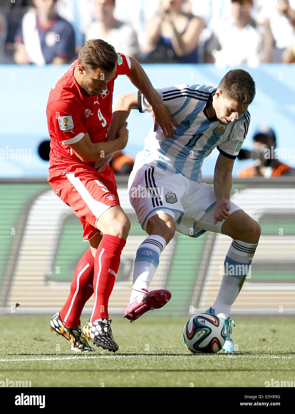 Sao Paulo, Brazil. 1st July, 2014. Switzerland's Haris Seferovic (L) vies with Argentina's Federico Fernandez during a Round of 16 match between Argentina and Switzerland of 2014 FIFA World Cup at the Arena de Sao Paulo Stadium in Sao Paulo, Brazil, on July 1, 2014. Credit:  Wang Lili/Xinhua/Alamy Live News Stock Photo