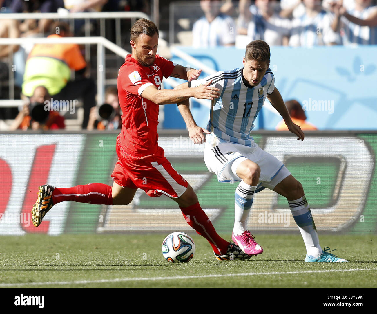Sao Paulo, Brazil. 1st July, 2014. Switzerland's Haris Seferovic (L) vies with Argentina's Federico Fernandez during a Round of 16 match between Argentina and Switzerland of 2014 FIFA World Cup at the Arena de Sao Paulo Stadium in Sao Paulo, Brazil, on July 1, 2014. Credit:  Wang Lili/Xinhua/Alamy Live News Stock Photo