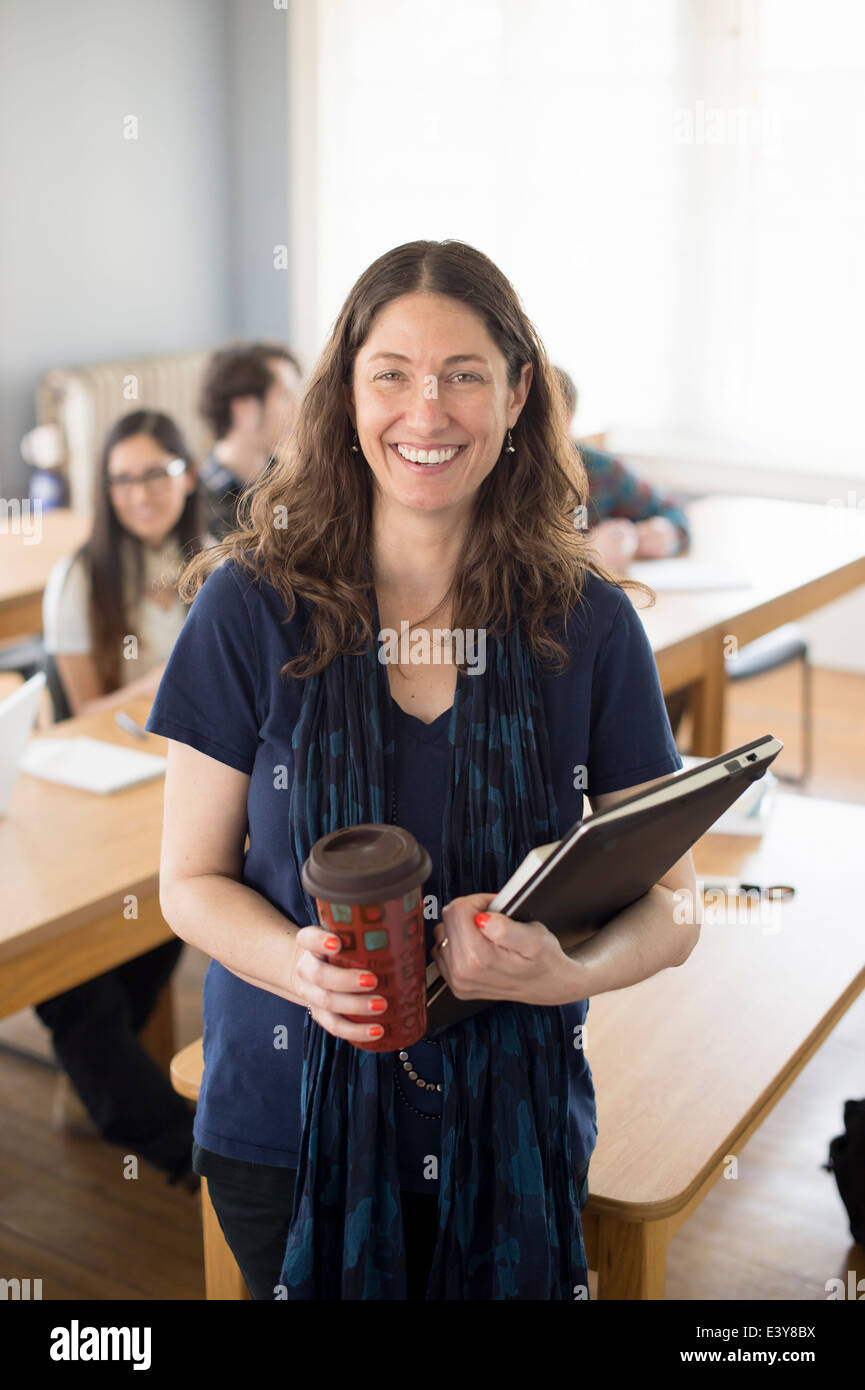 Teacher with notebook and coffee, portrait Stock Photo Alamy