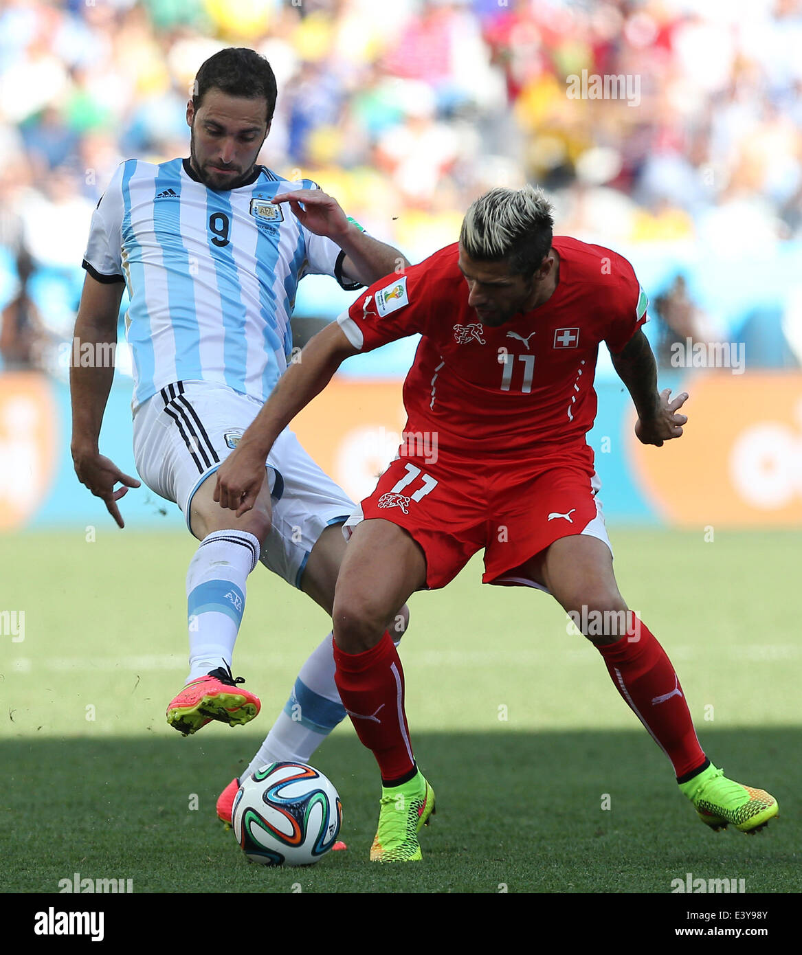 Sao Paulo, Brazil. 1st July, 2014. Argentina's Gonzalo Higuain vies with Switzerland's Valon Behrami during a Round of 16 match between Argentina and Switzerland of 2014 FIFA World Cup at the Arena de Sao Paulo Stadium in Sao Paulo, Brazil, on July 1, 2014. Credit:  Xu Zijian/Xinhua/Alamy Live News Stock Photo