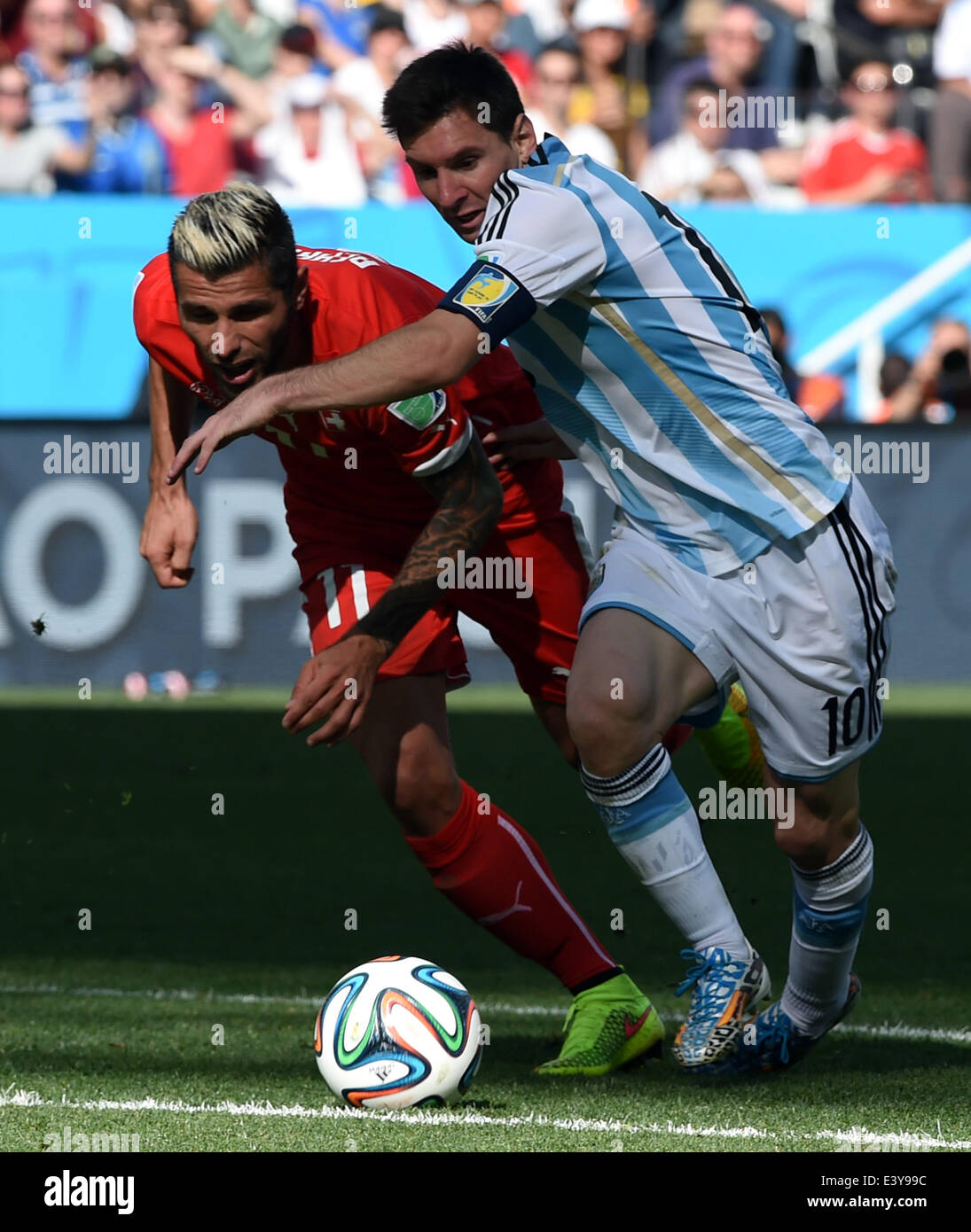 Sao Paulo, Brazil. 1st July, 2014. Argentina's Lionel Messi vies with Switzerland's Valon Behrami during a Round of 16 match between Argentina and Switzerland of 2014 FIFA World Cup at the Arena de Sao Paulo Stadium in Sao Paulo, Brazil, on July 1, 2014. Credit:  Wang Yuguo/Xinhua/Alamy Live News Stock Photo
