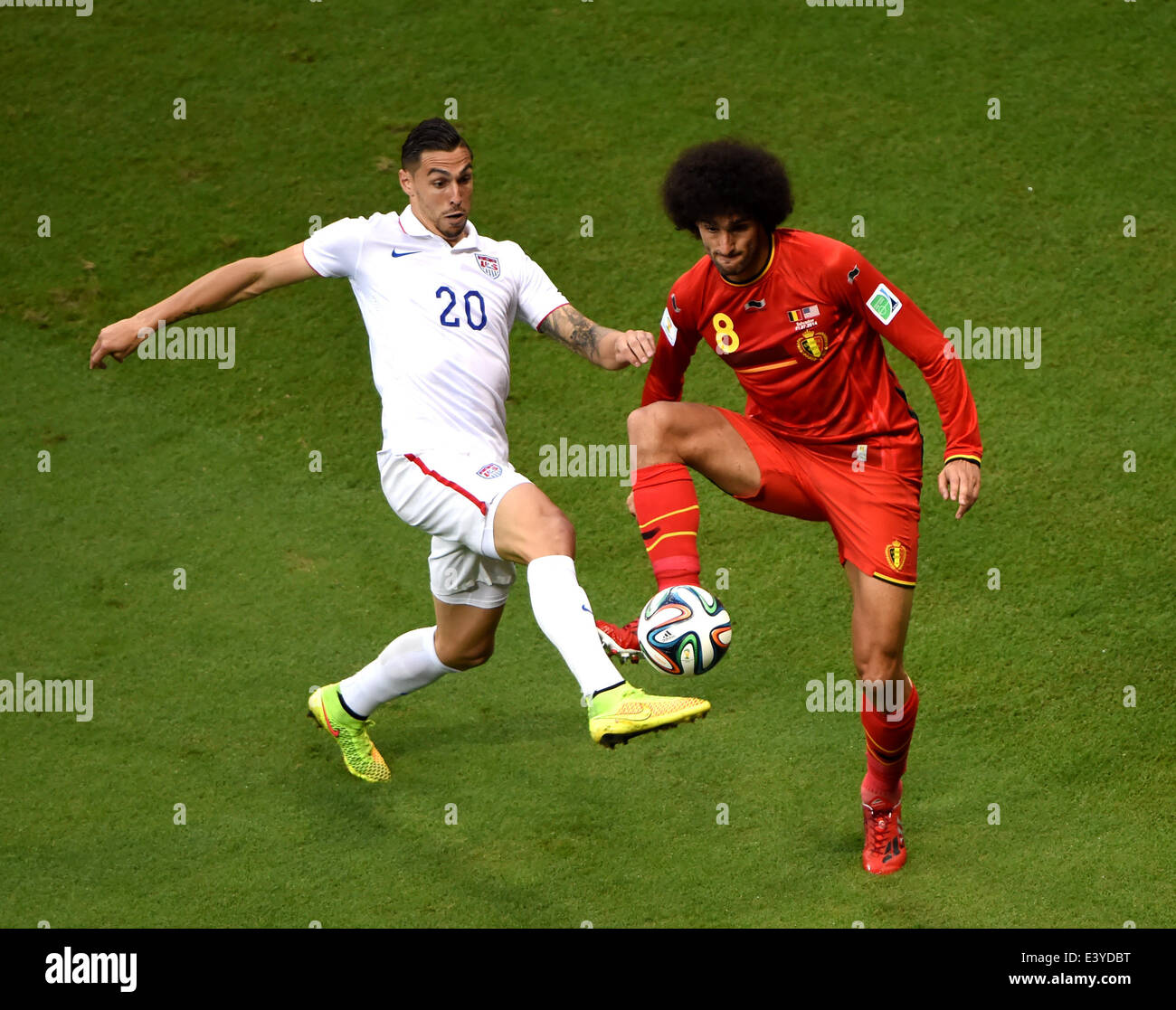 Salvador, Brazil. 1st July, 2014. Belgium's Marouane Fellaini (R) vies with Geoff Cameron of the U.S. during a Round of 16 match between Belgium and the U.S. of 2014 FIFA World Cup at the Arena Fonte Nova Stadium in Salvador, Brazil, on July 1, 2014. Credit:  Guo Yong/Xinhua/Alamy Live News Stock Photo