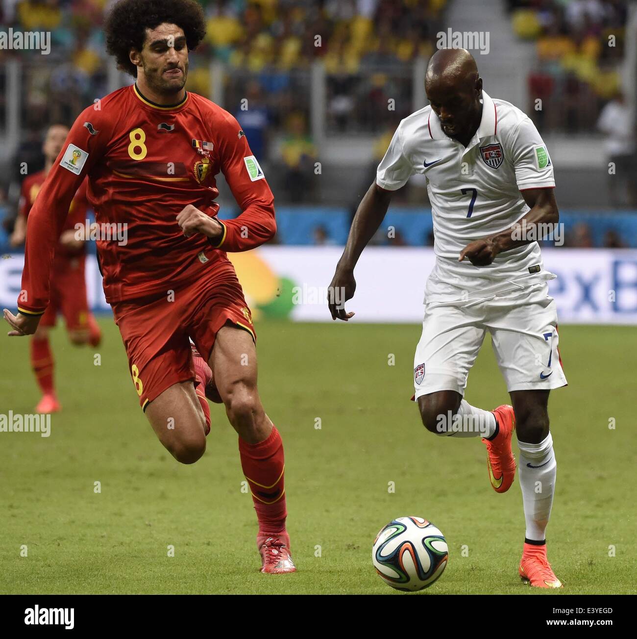 Salvador, Brazil. 1st July, 2014. DaMarcus Beasley (R) of the U.S. vies with Belgium's Marouane Fellaini during a Round of 16 match between Belgium and the U.S. of 2014 FIFA World Cup at the Arena Fonte Nova Stadium in Salvador, Brazil, on July 1, 2014. Credit:  Lui Siu Wai/Xinhua/Alamy Live News Stock Photo