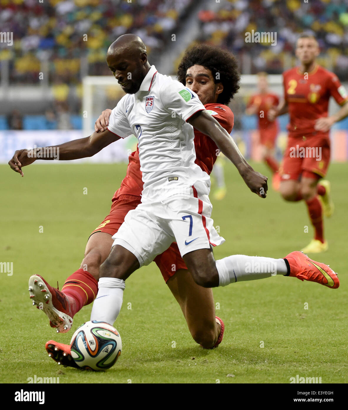 Salvador, Brazil. 1st July, 2014. DaMarcus Beasley (front) of the U.S. vies with Belgium's Marouane Fellaini during a Round of 16 match between Belgium and the U.S. of 2014 FIFA World Cup at the Arena Fonte Nova Stadium in Salvador, Brazil, on July 1, 2014. Credit:  Lui Siu Wai/Xinhua/Alamy Live News Stock Photo