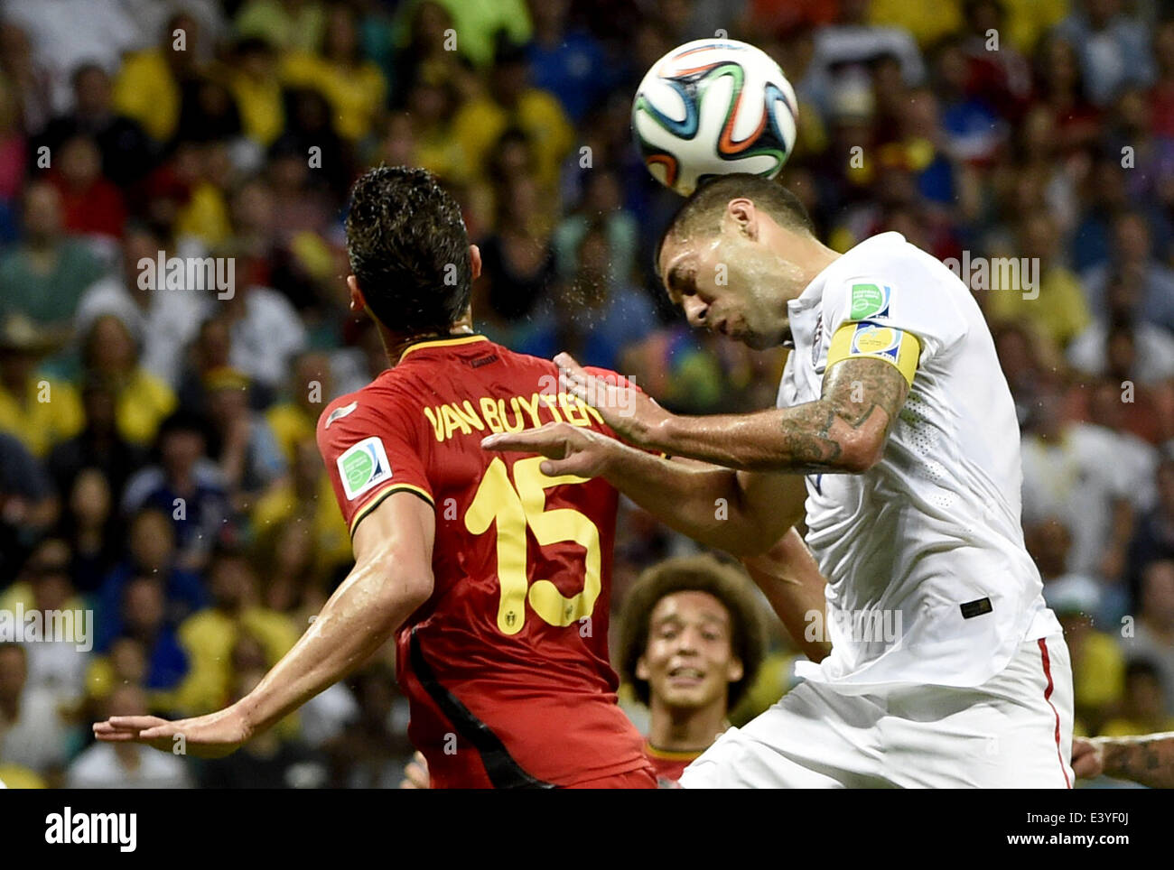 Salvador, Brazil. 1st July, 2014. Clint Dempsey (R) of the U.S. competes for a header with Belgium's Daniel Van Buyten during a Round of 16 match between Belgium and the U.S. of 2014 FIFA World Cup at the Arena Fonte Nova Stadium in Salvador, Brazil, on July 1, 2014. Credit:  Lui Siu Wai/Xinhua/Alamy Live News Stock Photo