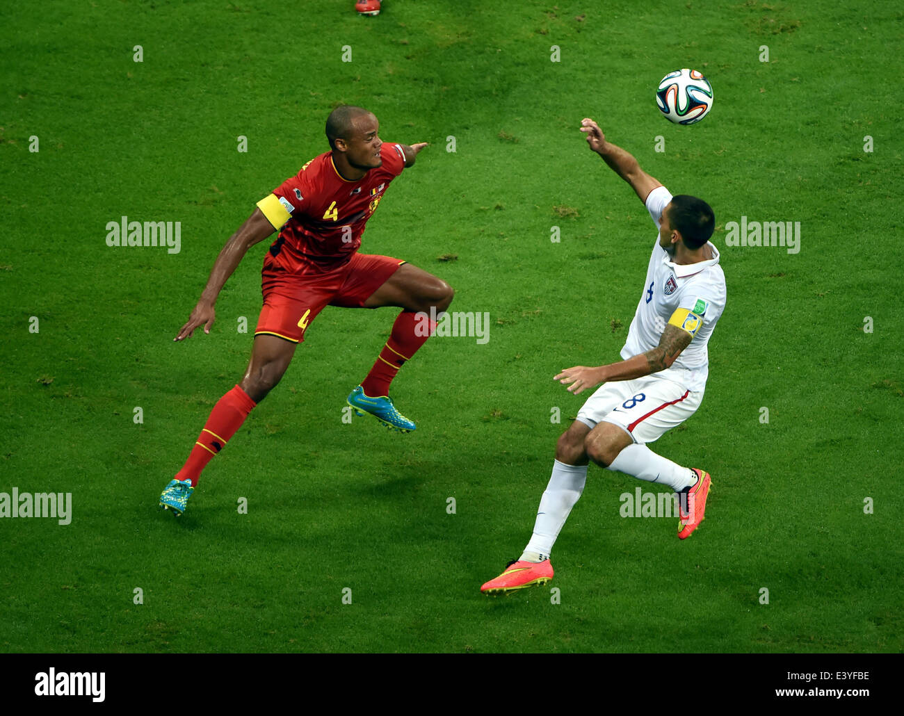 Salvador, Brazil. 1st July, 2014. Clint Dempsey (R) of the U.S. vies with Belgium's Vincent Kompany during a Round of 16 match between Belgium and the U.S. of 2014 FIFA World Cup at the Arena Fonte Nova Stadium in Salvador, Brazil, on July 1, 2014. Credit:  Guo Yong/Xinhua/Alamy Live News Stock Photo