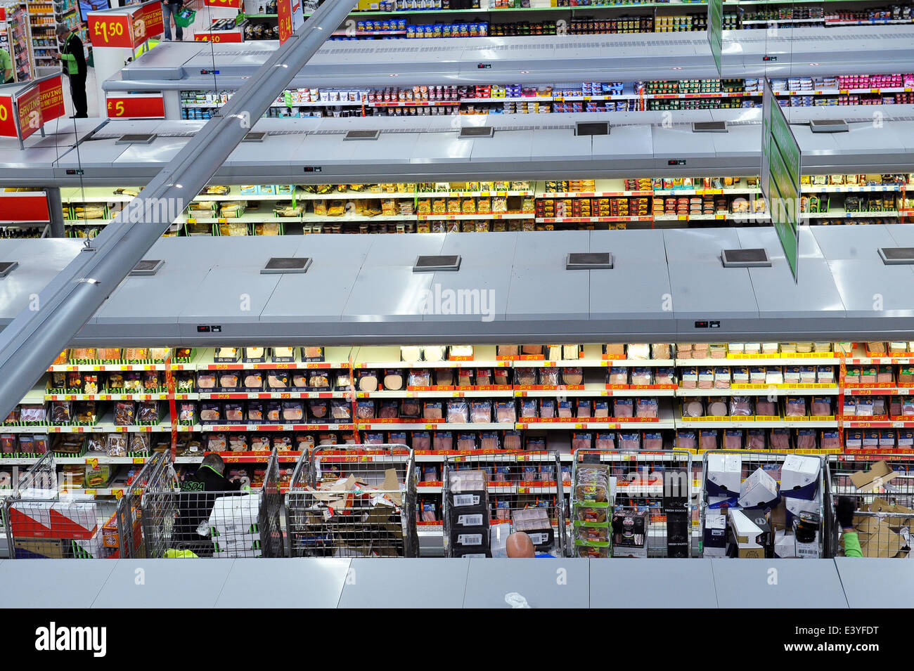 stocking shelves supermarket interior 2014 Stock Photo