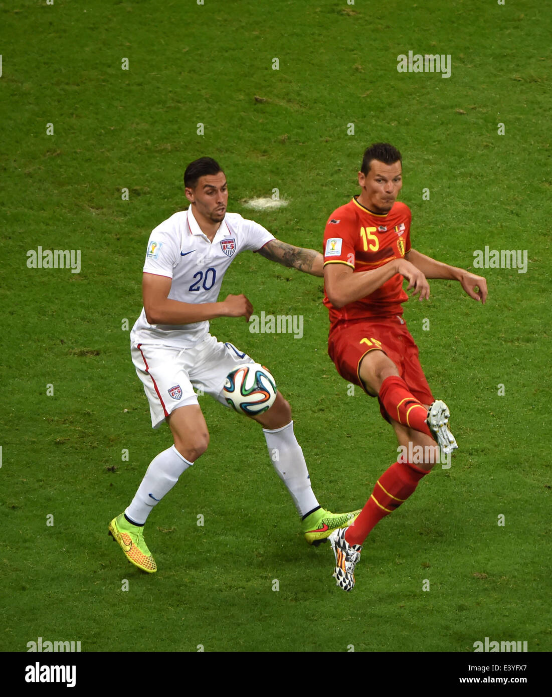Salvador, Brazil. 1st July, 2014. Geoff Cameron (L) of the U.S. vies with Belgium's Daniel Van Buyten during a Round of 16 match between Belgium and the U.S. of 2014 FIFA World Cup at the Arena Fonte Nova Stadium in Salvador, Brazil, on July 1, 2014. Credit:  Guo Yong/Xinhua/Alamy Live News Stock Photo