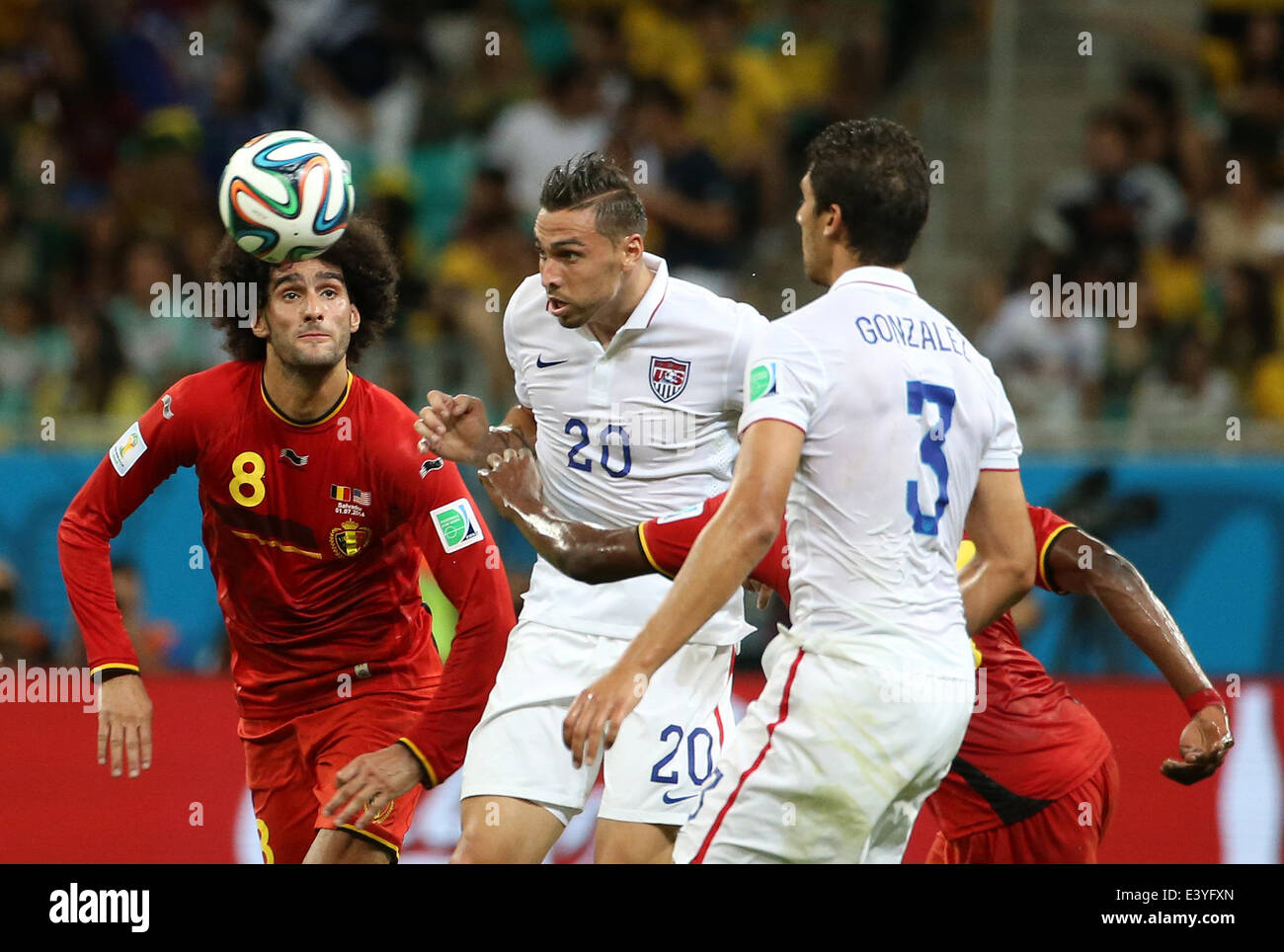 Salvador, Brazil. 1st July, 2014. Belgium's Marouane Fellaini (L) vies with Geoff Cameron (C) of the U.S. during a Round of 16 match between Belgium and the U.S. of 2014 FIFA World Cup at the Arena Fonte Nova Stadium in Salvador, Brazil, on July 1, 2014. Credit:  Cao Can/Xinhua/Alamy Live News Stock Photo