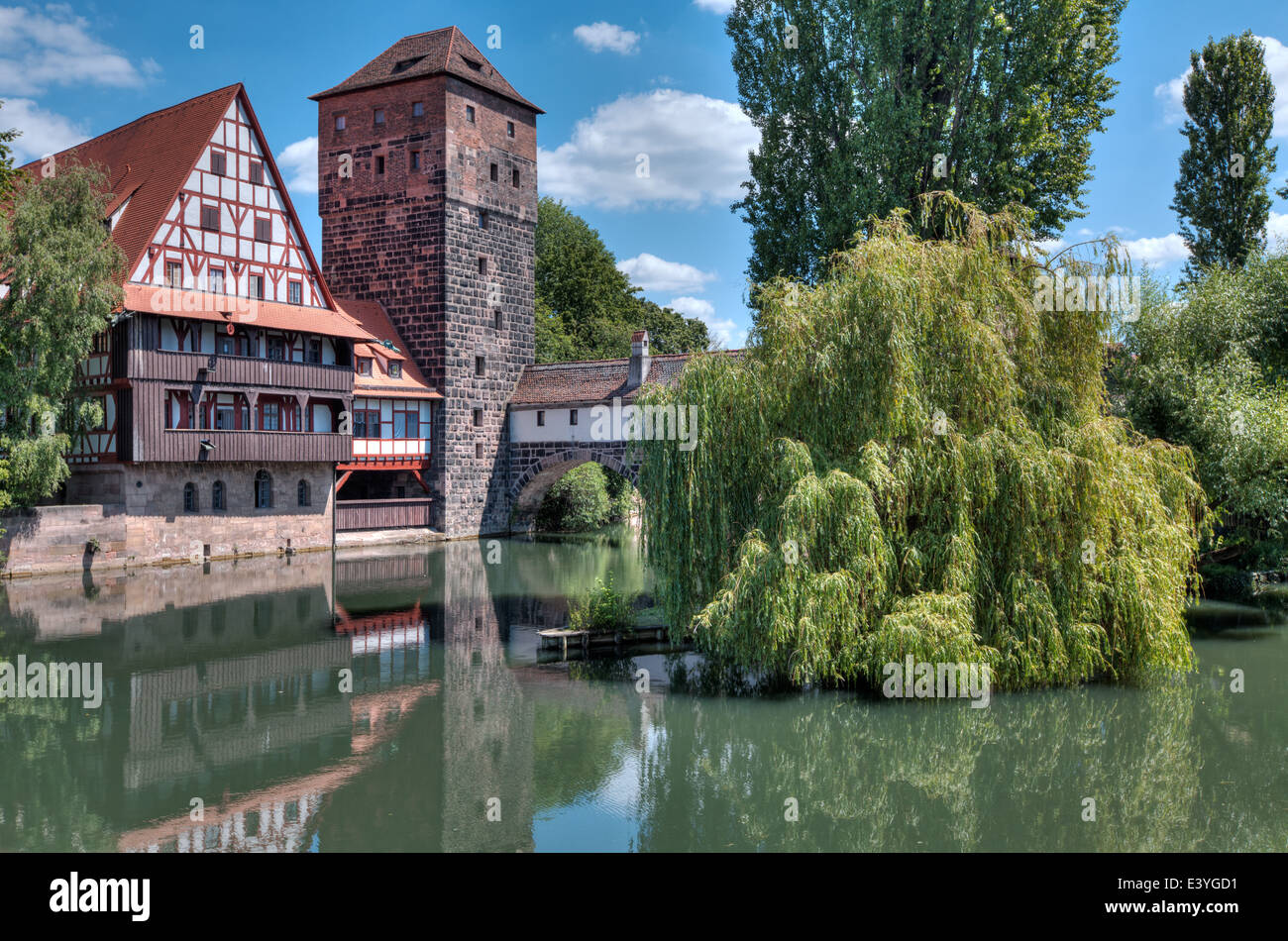 The famous Weinstadel and Wasserturm (Water Tower) over the river Pegnitz in the German city of Nuremberg. Stock Photo