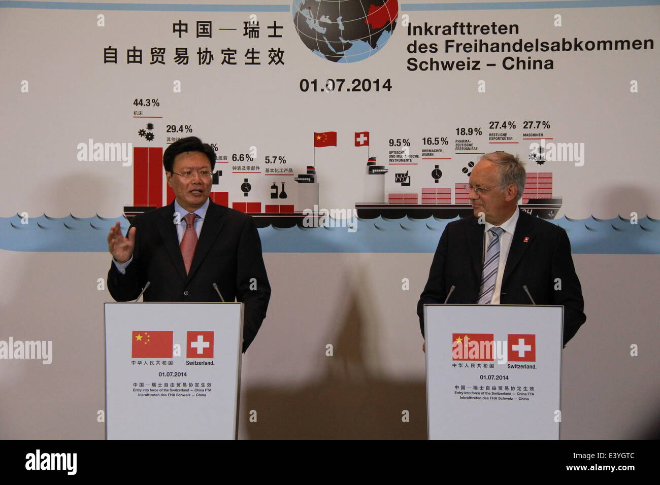 Basel, Switzerland. 1st July, 2014. China's ambassador to the World Trade Organization Yu Jianhua (L) and Swiss Federal Councilor Johann Schneider-Ammann attend a press conference held in the Rhine port in Basel, Switzerland, July 1, 2014. With the witness of first tariff-free goods landed and left Swiss northwestern Rhine port of Basel, the Free Trade Agreement (FTA) between China and Switzerland entered into force on Tuesday. © Zhang Miao/Xinhua/Alamy Live News Stock Photo