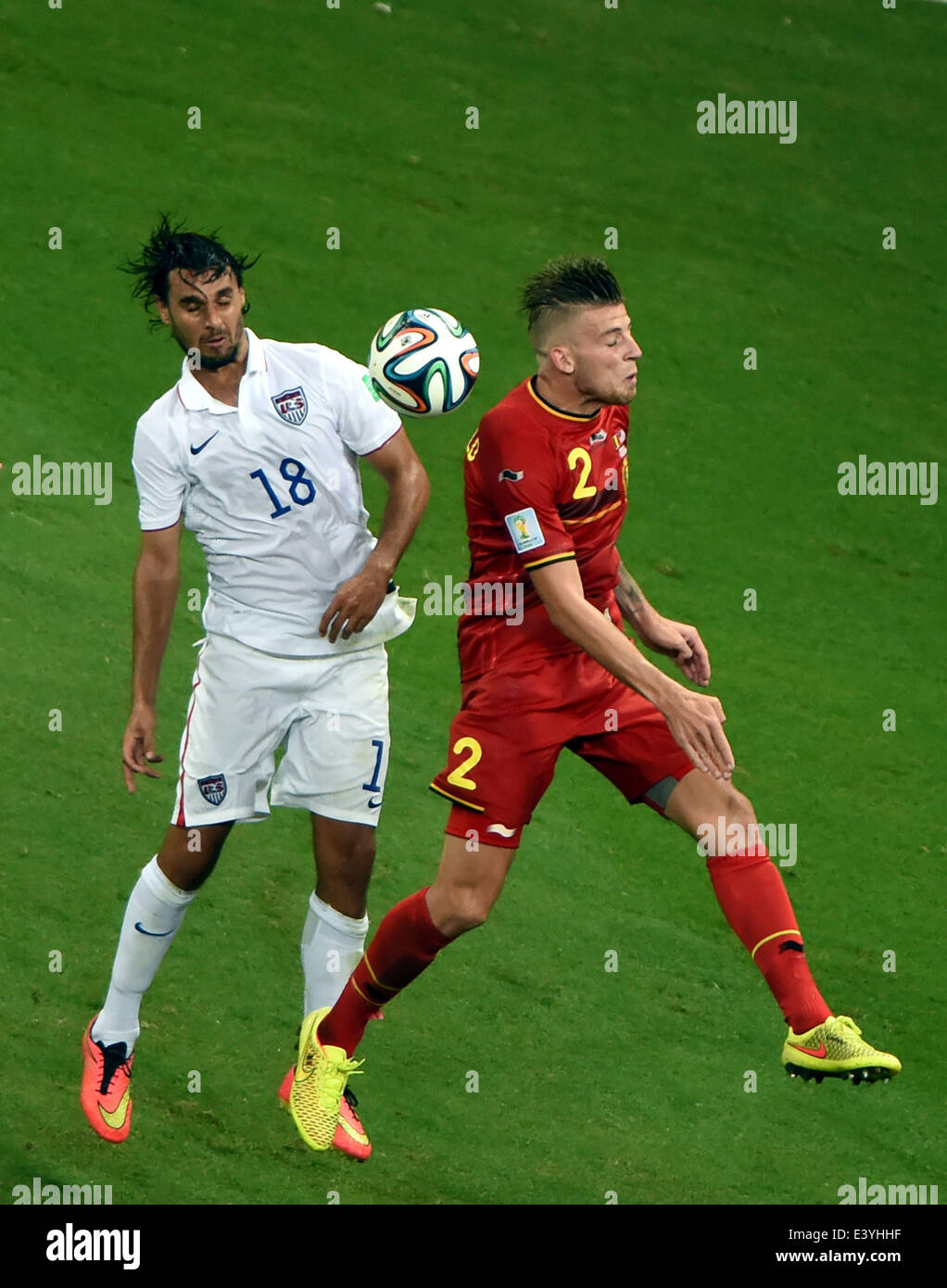 Salvador, Brazil. 1st July, 2014. Belgium's Toby Alderweireld (R) vies with Chris Wondolowski of the U.S. during a Round of 16 match between Belgium and the U.S. of 2014 FIFA World Cup at the Arena Fonte Nova Stadium in Salvador, Brazil, on July 1, 2014. Belgium won 2-1 over the U.S. after 120 minutes and qualified for quarter-finals on Tuesday. Credit:  Guo Yong/Xinhua/Alamy Live News Stock Photo