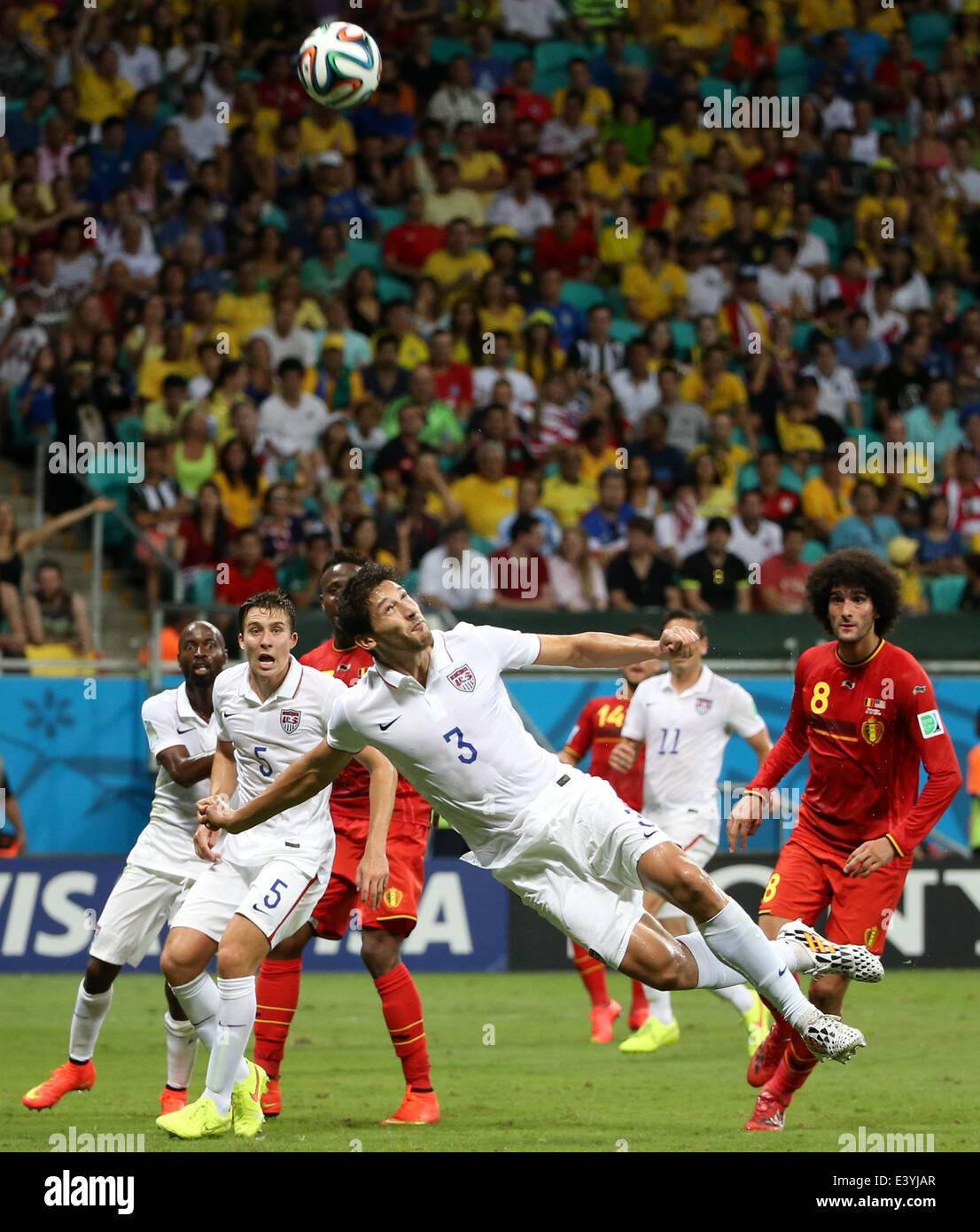 Salvador, Brazil. 1st July, 2014. Omar Gonzalez (C) of the U.S. vies for the ball during a Round of 16 match between Belgium and the U.S. of 2014 FIFA World Cup at the Arena Fonte Nova Stadium in Salvador, Brazil, on July 1, 2014. Belgium won 2-1 over the U.S. after 120 minutes and qualified for quarter-finals on Tuesday. Credit:  Cao Can/Xinhua/Alamy Live News Stock Photo