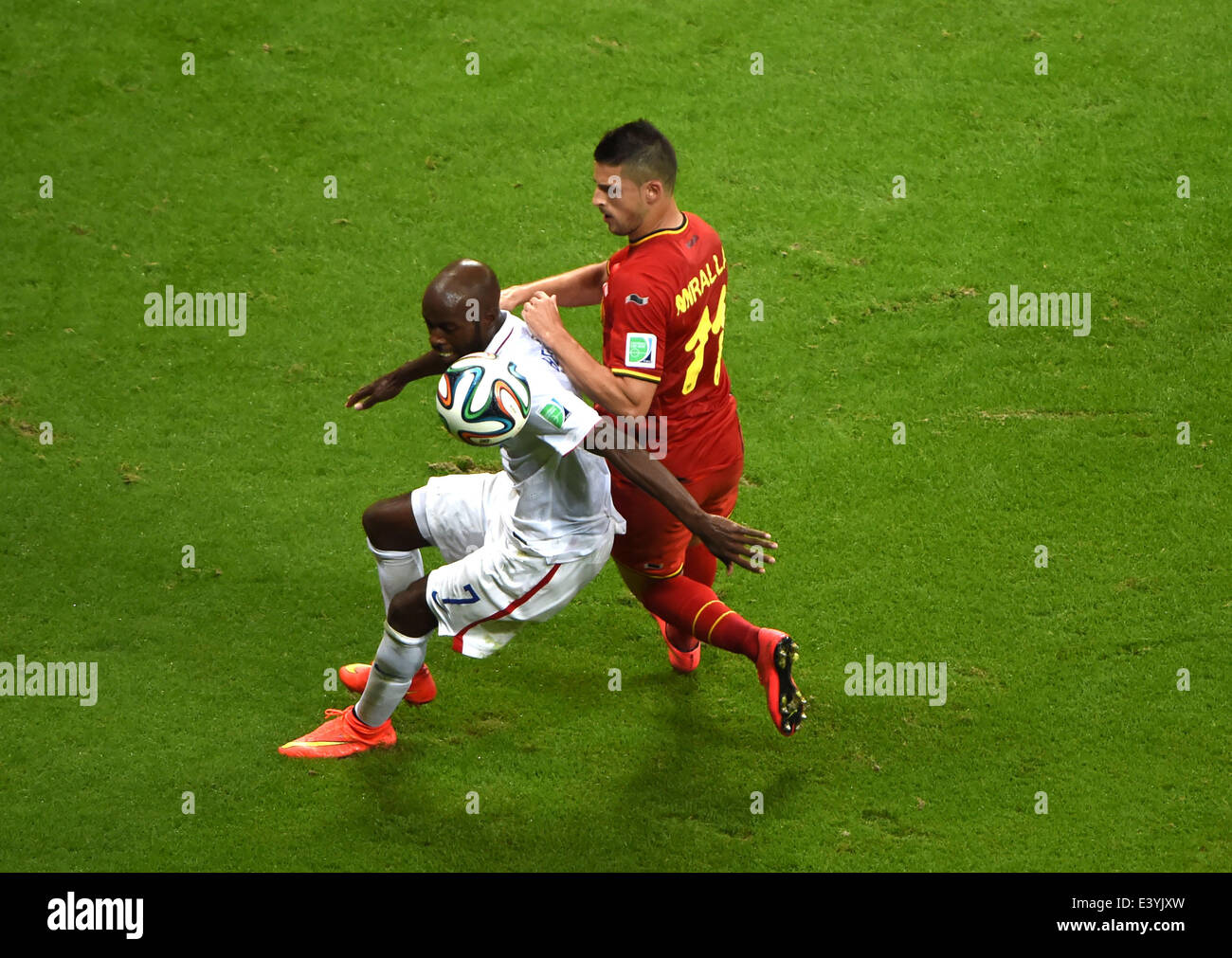 Salvador, Brazil. 1st July, 2014. Belgium's Kevin Mirallas (R) vies with DaMarcus Beasley of the U.S. during a Round of 16 match between Belgium and the U.S. of 2014 FIFA World Cup at the Arena Fonte Nova Stadium in Salvador, Brazil, on July 1, 2014. Belgium won 2-1 over the U.S. after 120 minutes and qualified for quarter-finals on Tuesday. Credit:  Guo Yong/Xinhua/Alamy Live News Stock Photo
