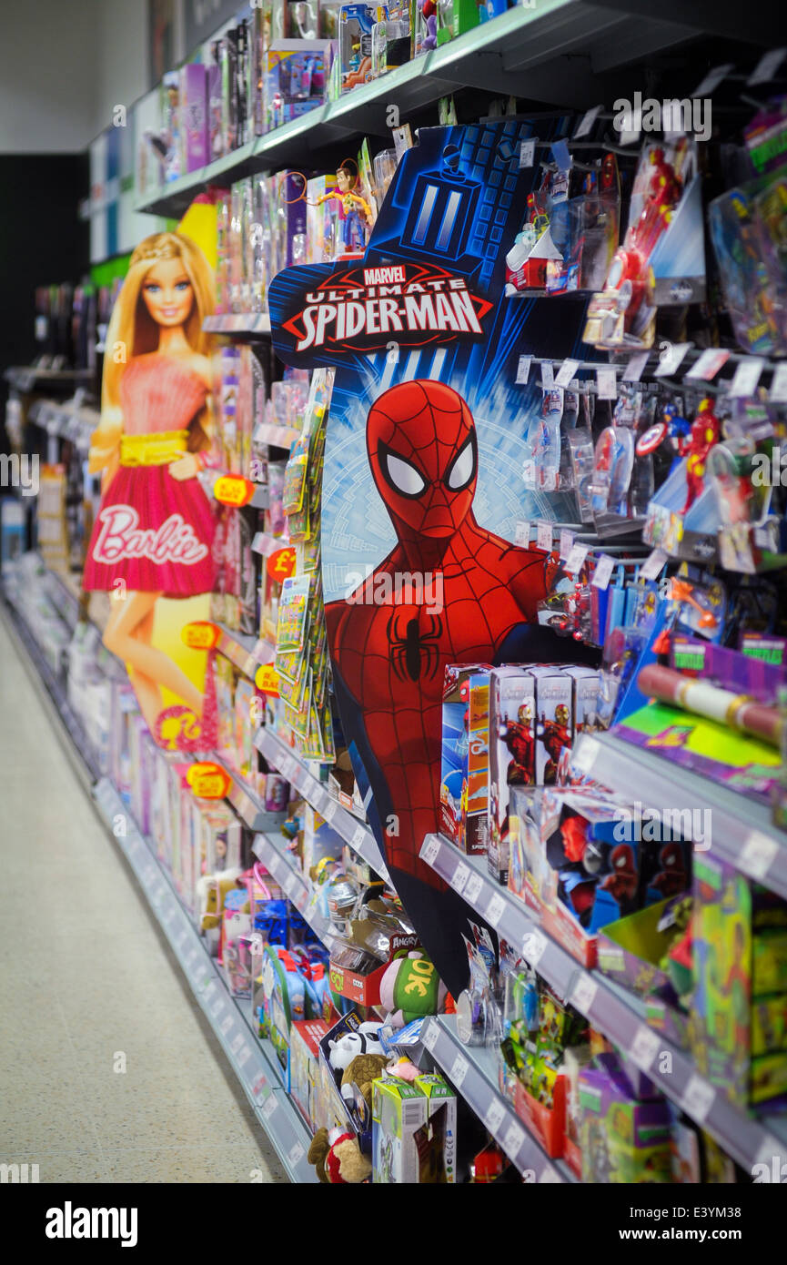 Spiderman and Barbie for sale on the toy aisle at a supermarket Stock Photo