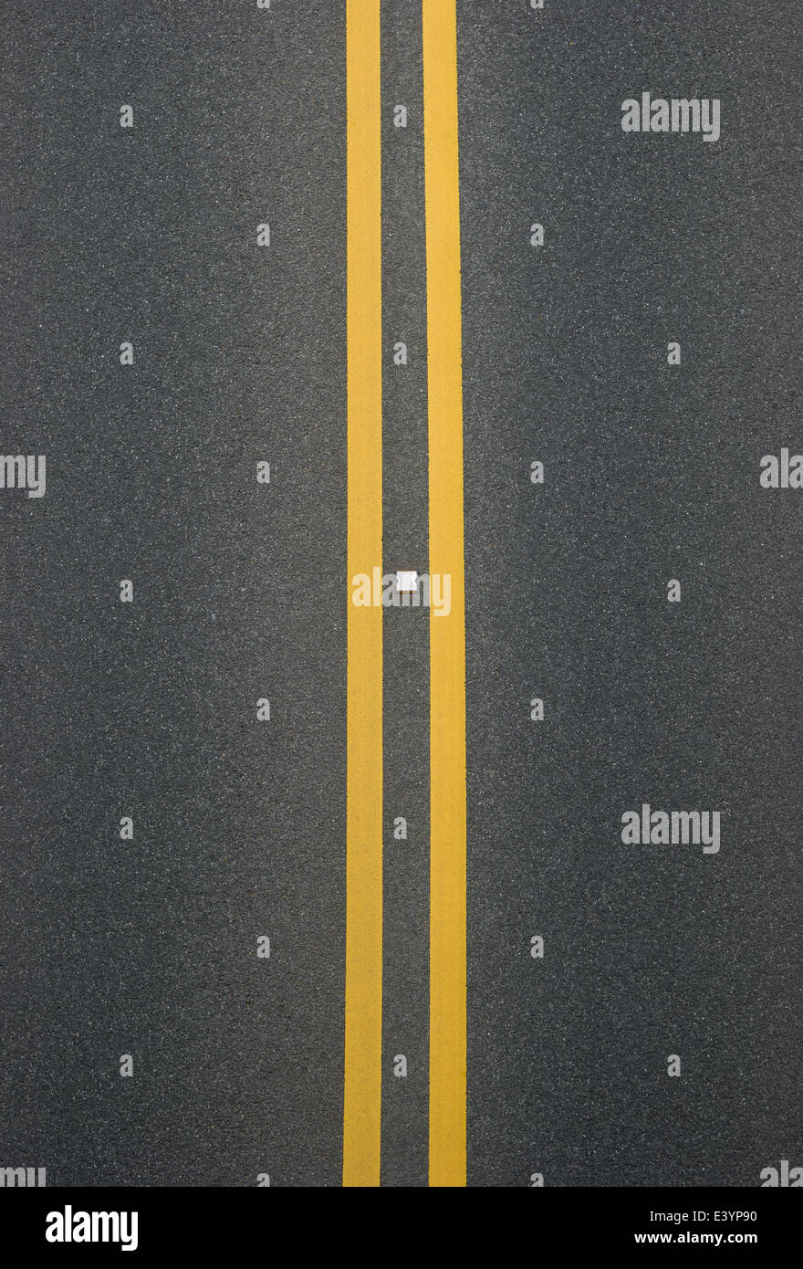 double yellow lines divider on blacktop Stock Photo Alamy