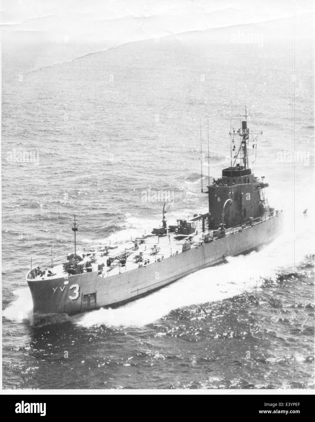 The USS Targeteer YV-3, an aircraft catapult designed for launching drones, captured in a historic naval photograph, highlighting its role in military operations and naval history. Stock Photo