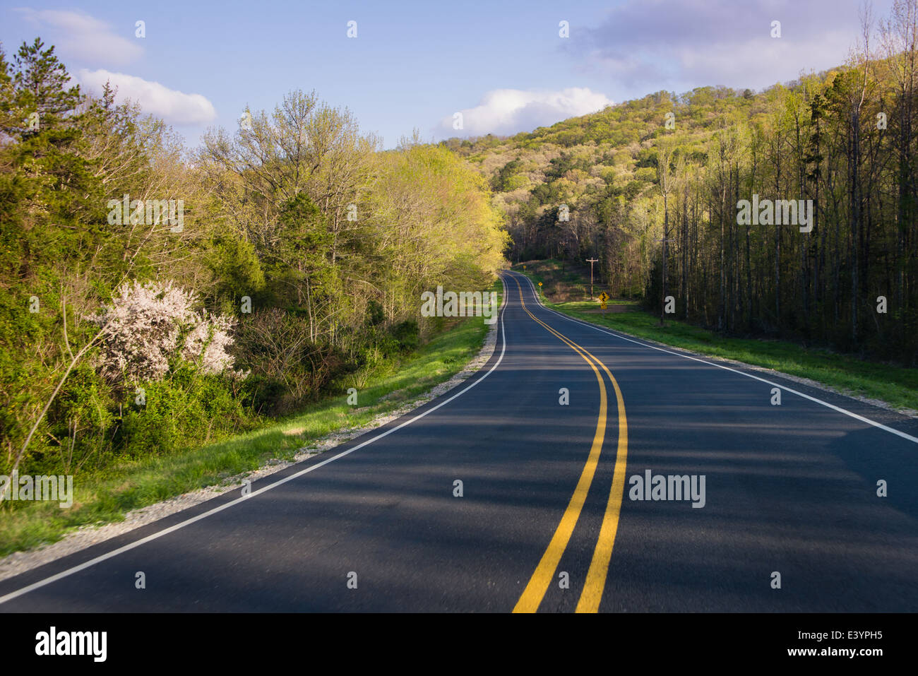 Highway 16 outside of Greers Ferry, Arkansas receding into the distance. Stock Photo