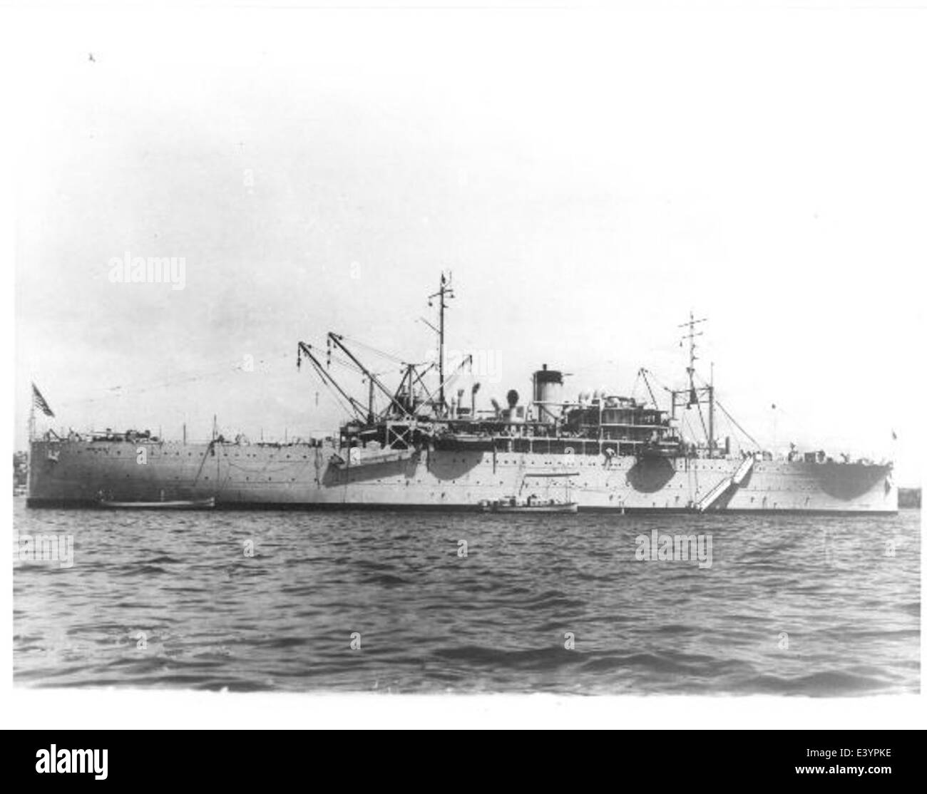 This photograph depicts the USS Wright (AZ/AV-1), an aviation tender ship that served the U.S. Navy, supporting naval aviation operations with repair and maintenance capabilities. Stock Photo