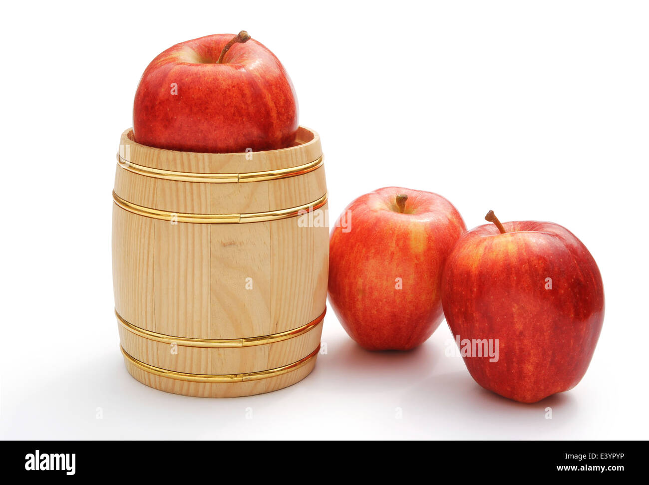 fresh apples in wooden barrel on white with clipping path Stock Photo