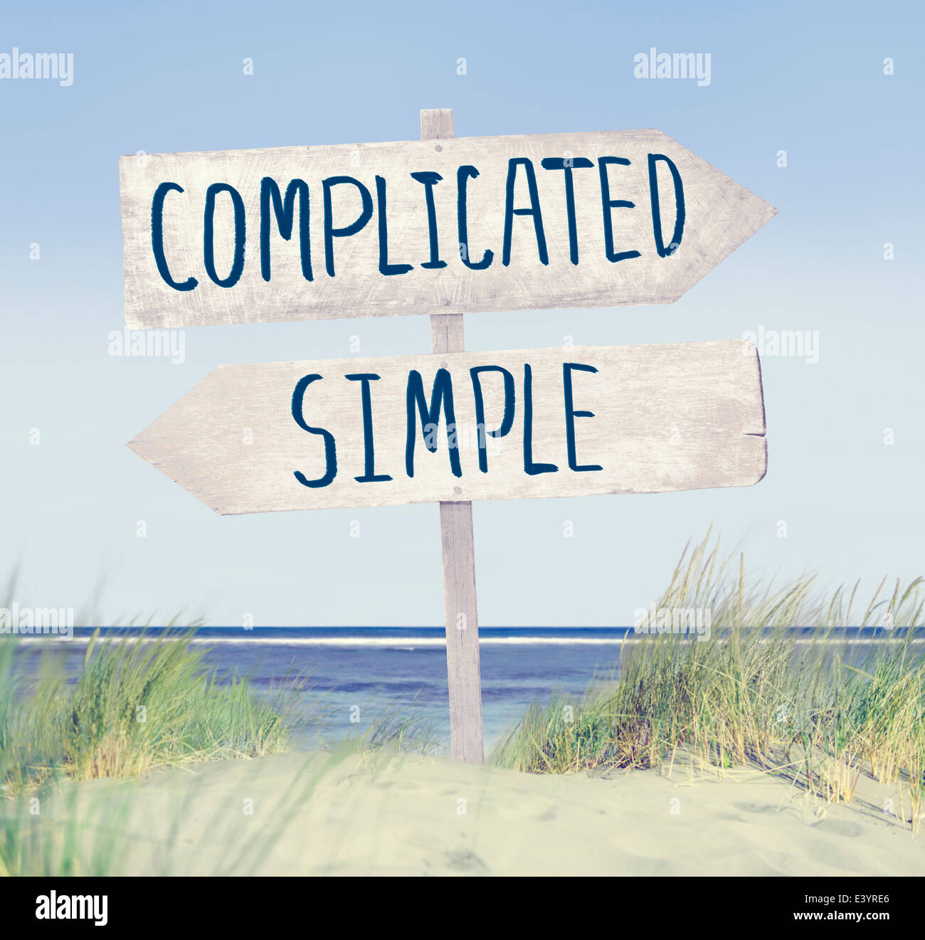 Direction Label on Beach with Complicated and Simple Text Stock Photo