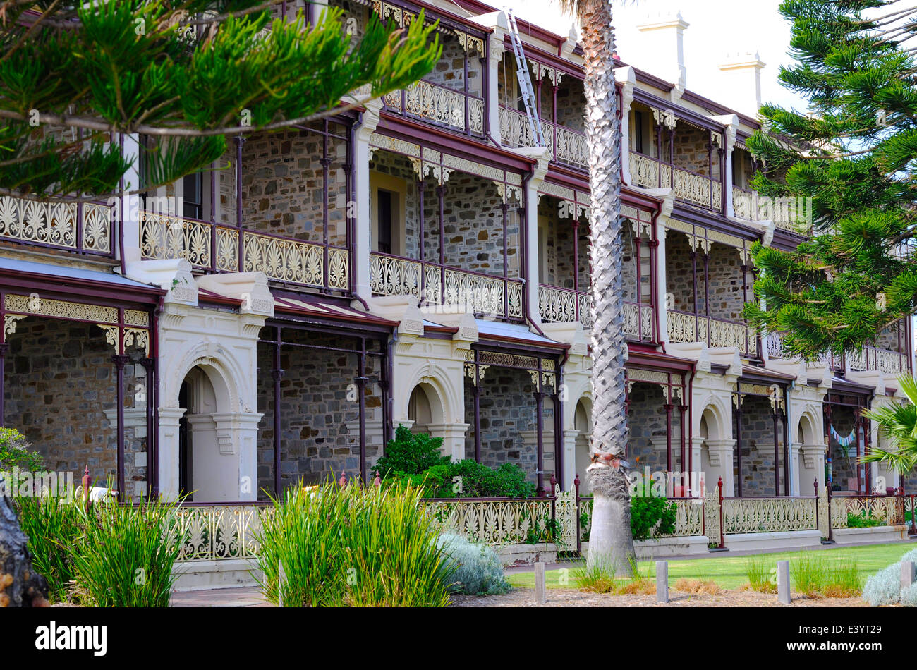 Row of Victorian style bluestone and sandstone three story homes Stock
