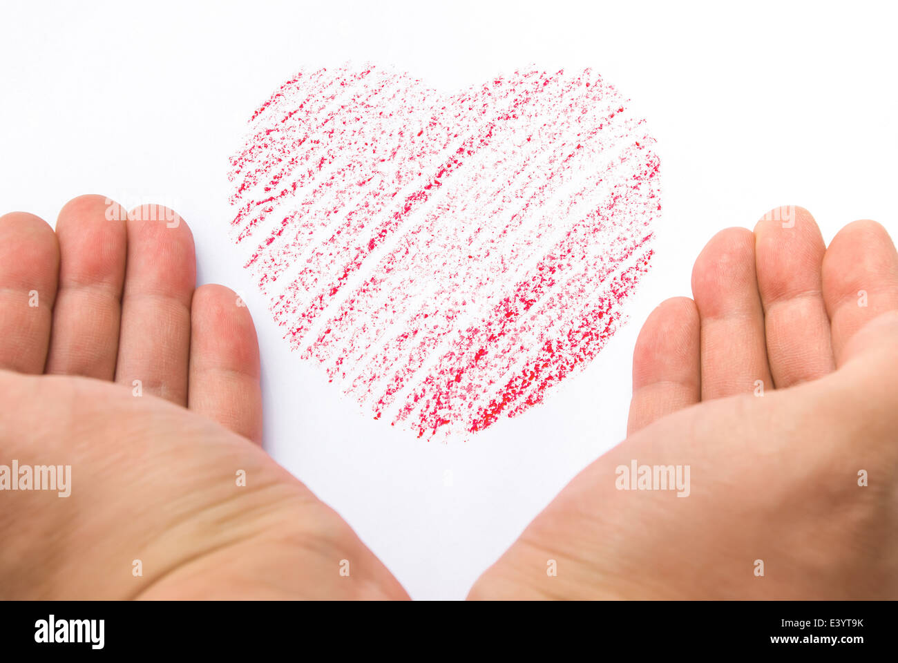hands holding a heart sketch Stock Photo