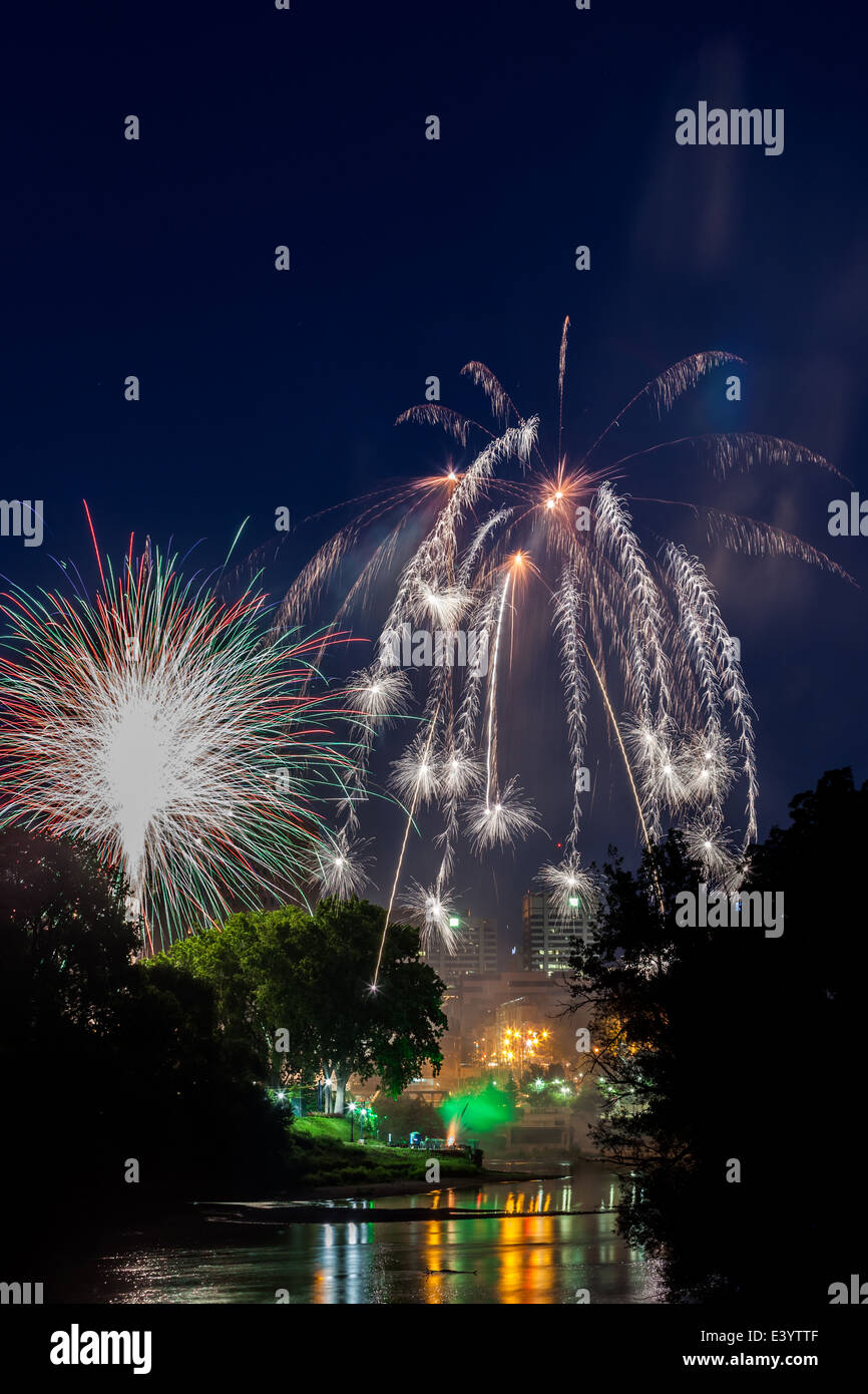Fireworks light up over the forks of the Thames River in London Ontario, Canada in celebration of Canada Day on July 1st, 2014. Stock Photo