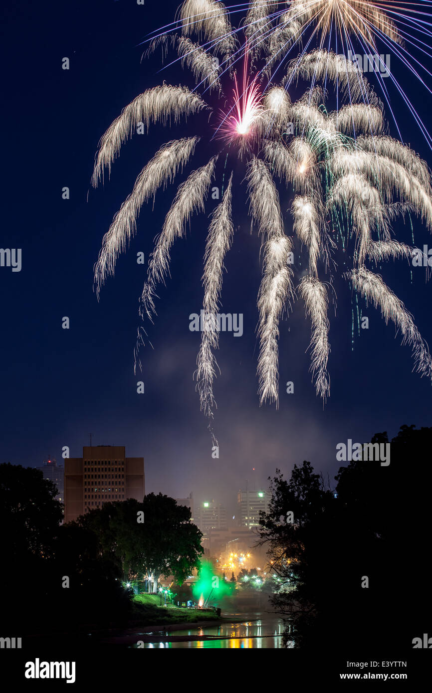Fireworks light up over the forks of the Thames River in London Ontario, Canada in celebration of Canada Day on July 1st, 2014. Stock Photo