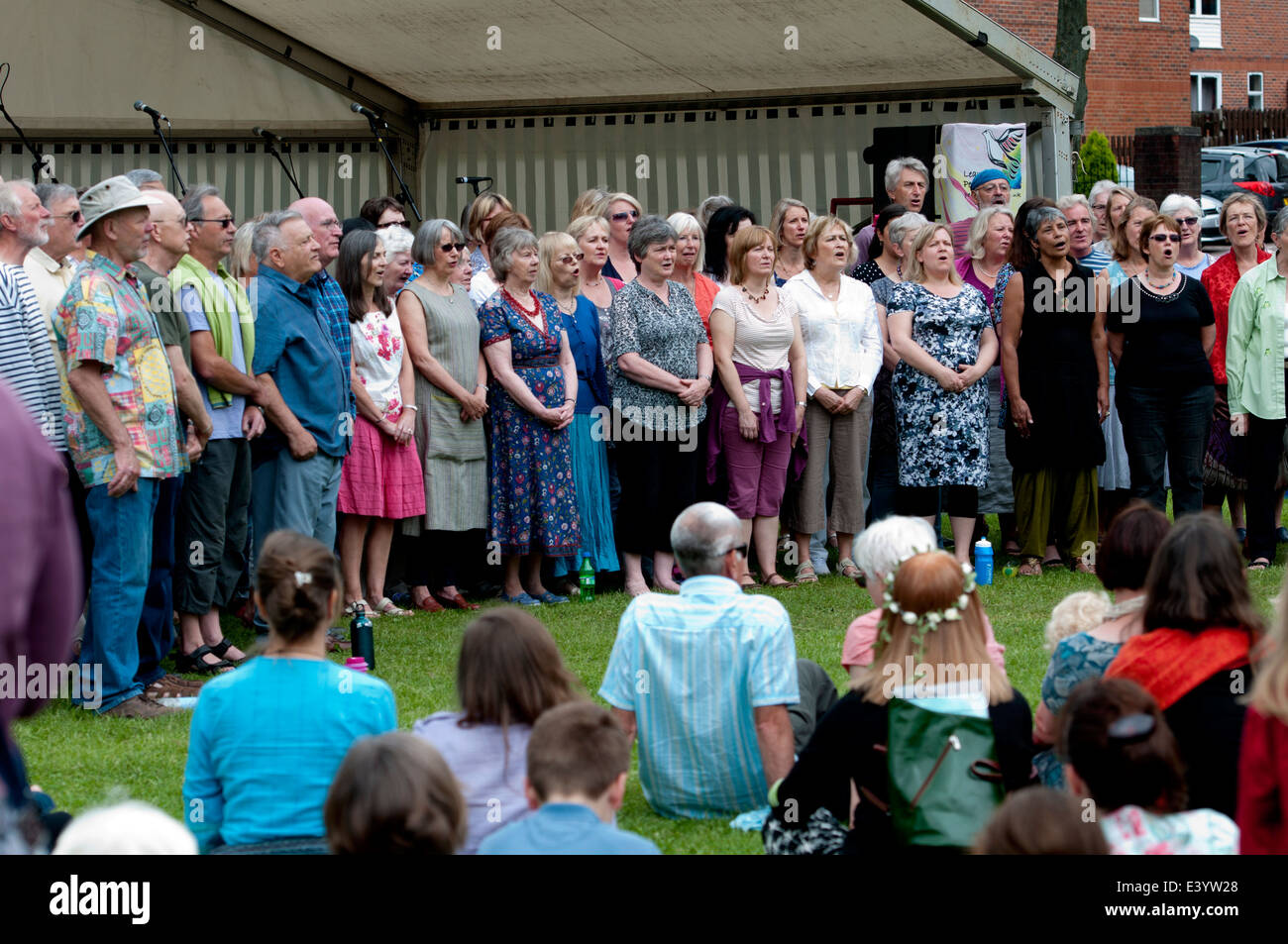 A community choir singing at Leamington Peace Festival, UK Stock Photo
