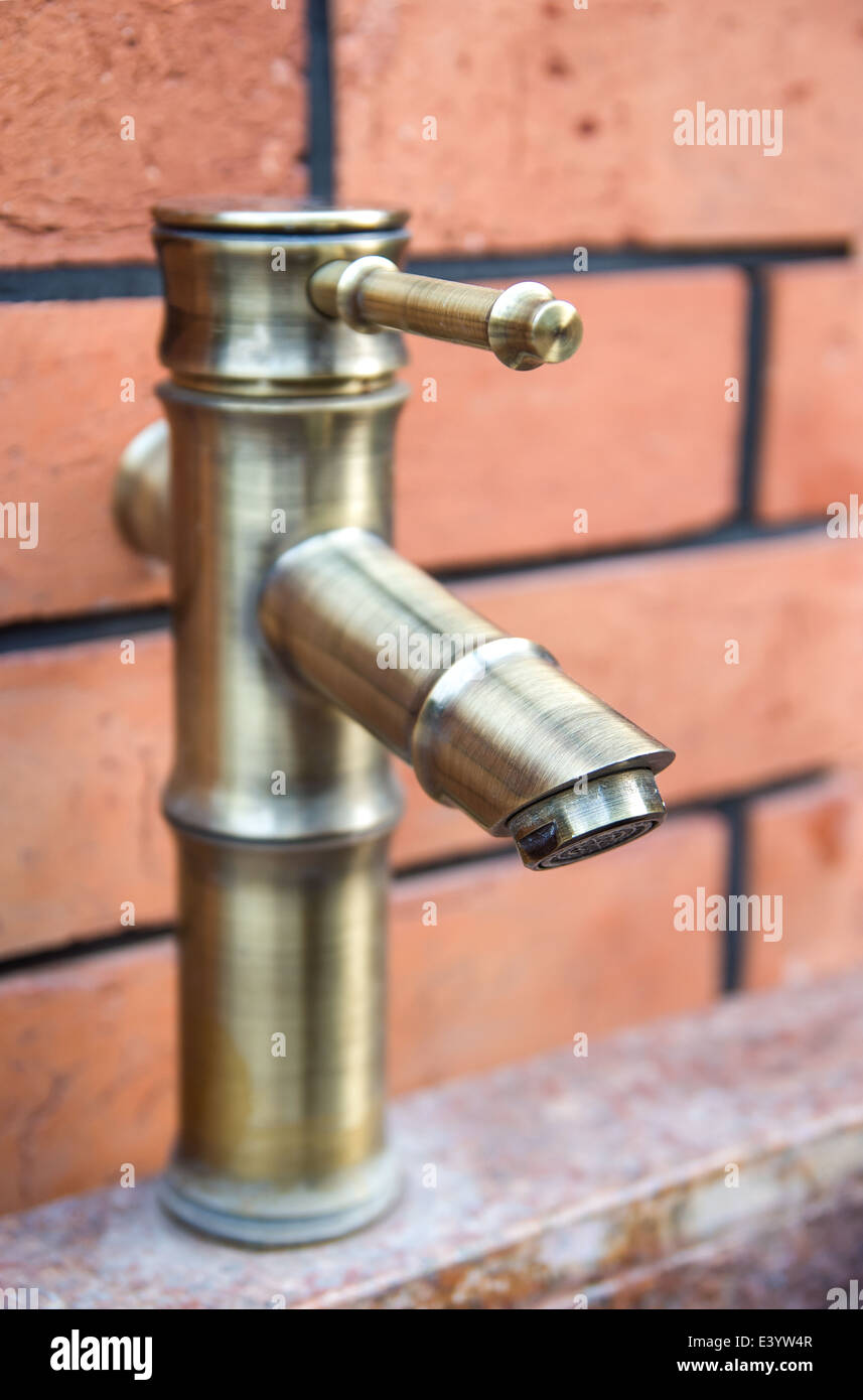 old style brass water tap Stock Photo