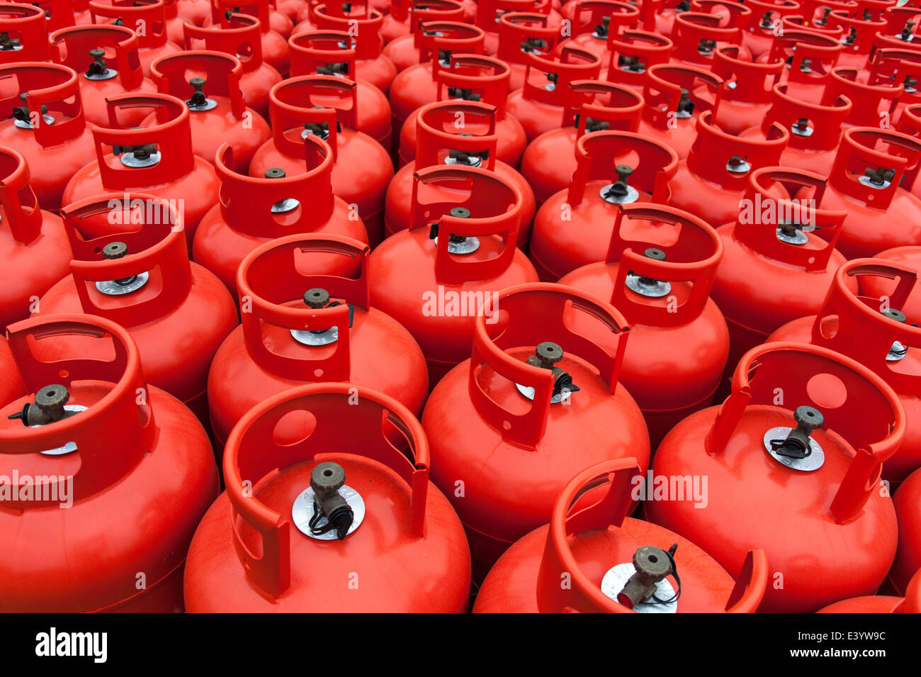 Close up of hundreds of gas bottles waiting in a storage depot. Stock Photo