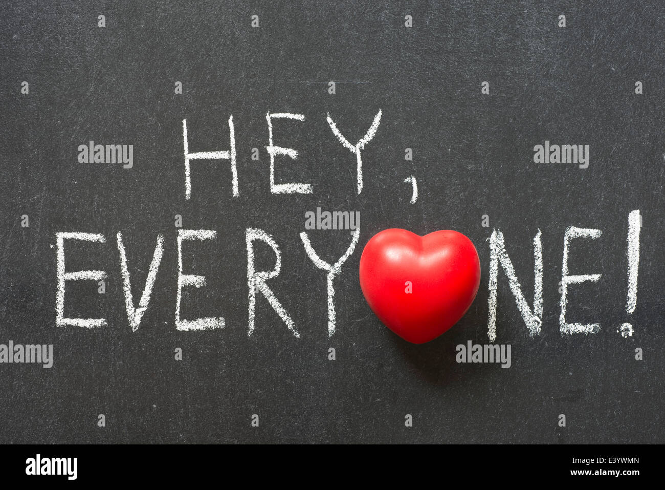hey, everyone exclamation handwritten on chalkboard with heart symbol instead of O Stock Photo