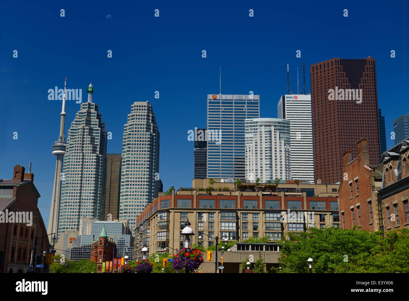 St Lawrence Market and Gooderham Flatiron building with CN tower and financial district bank towers Toronto at half moon with blue sky Stock Photo