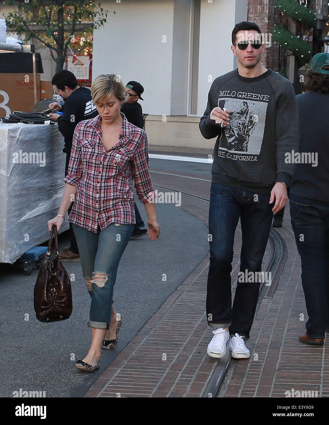 Los Angeles Clipper J J Redick walks with a Clipped wing with wife