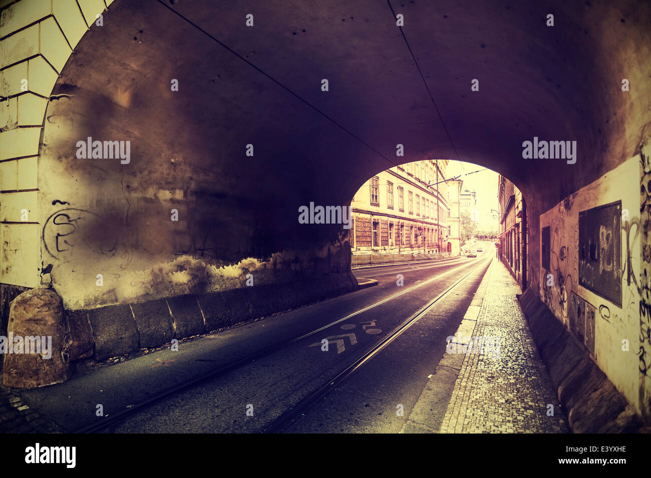 Vintage photo of old european street and tunnel in Prague. Stock Photo